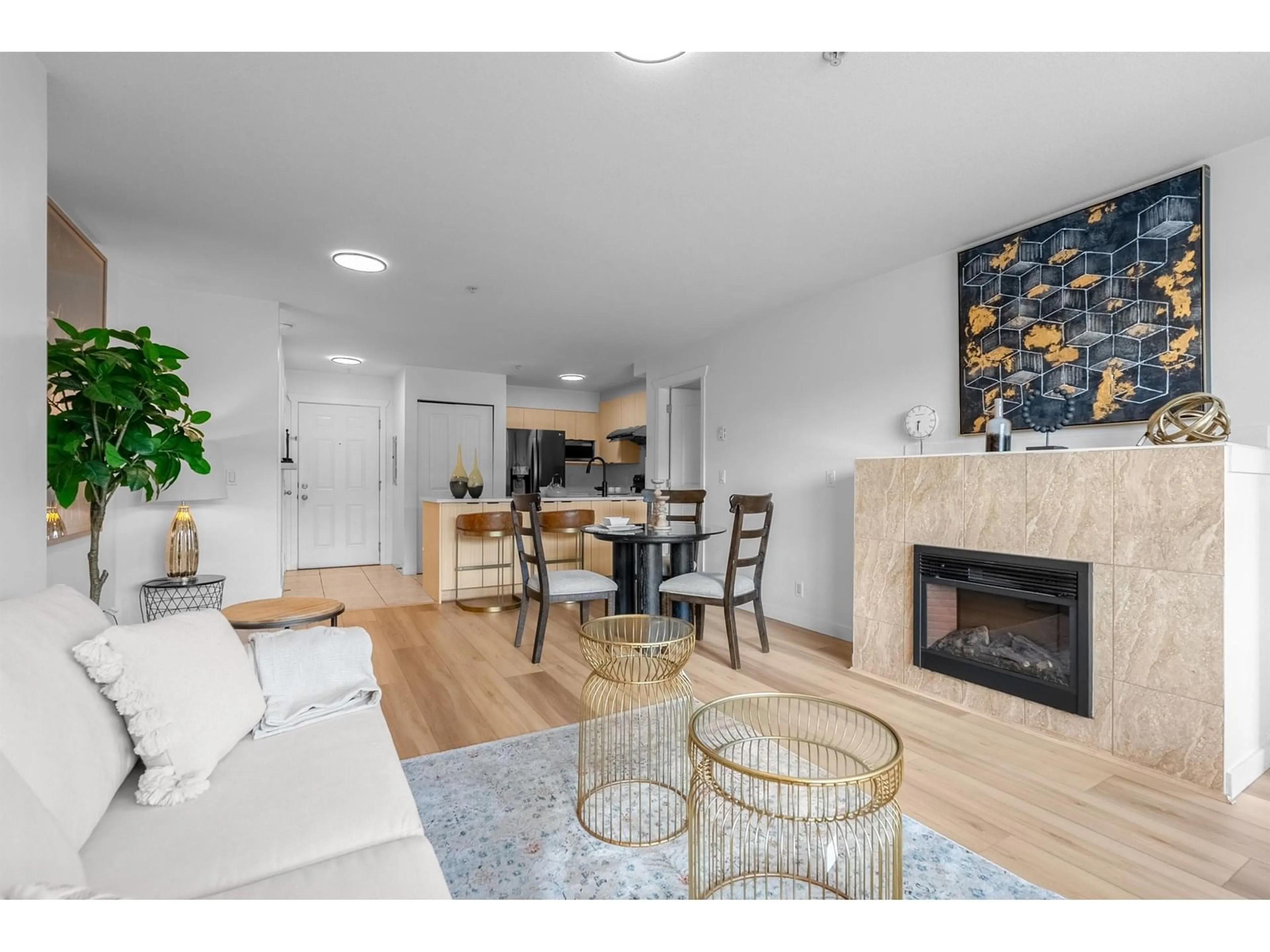 Living room with furniture, wood/laminate floor for 314 - 6960 120, Surrey British Columbia V3W1V4