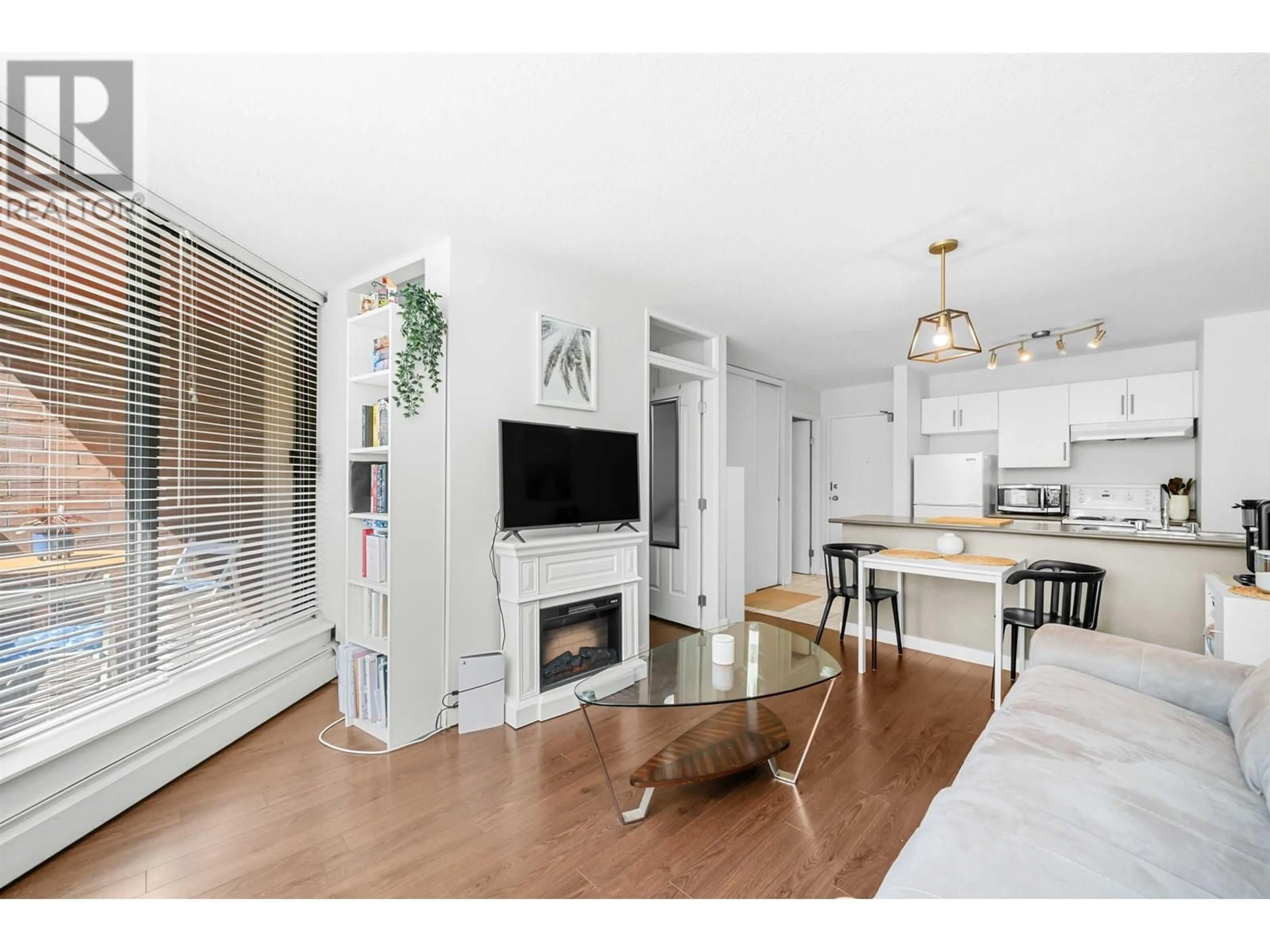 Living room with furniture, wood/laminate floor for 318 - 1330 BURRARD STREET, Vancouver British Columbia V6Z2B8