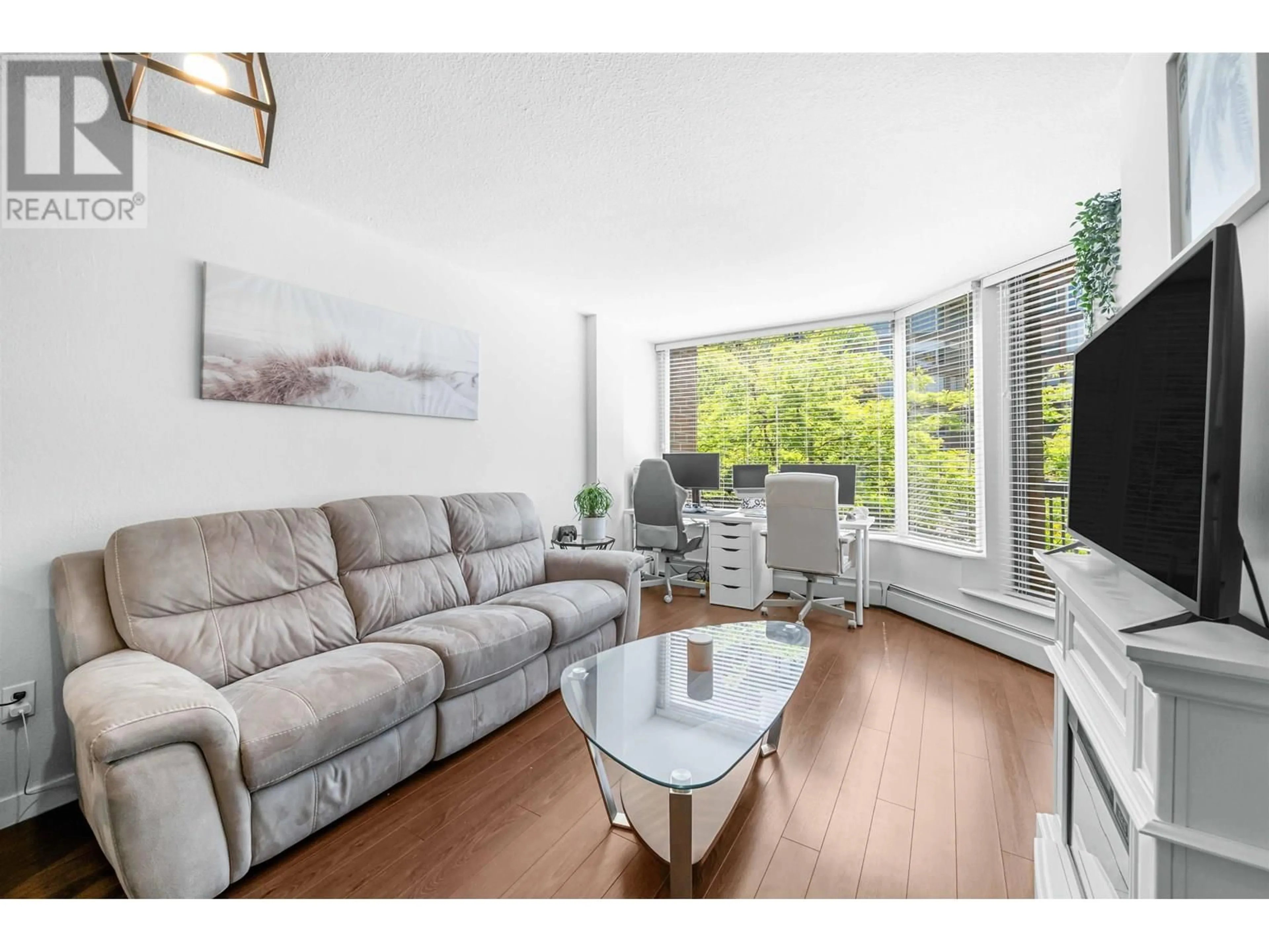 Living room with furniture, wood/laminate floor for 318 - 1330 BURRARD STREET, Vancouver British Columbia V6Z2B8