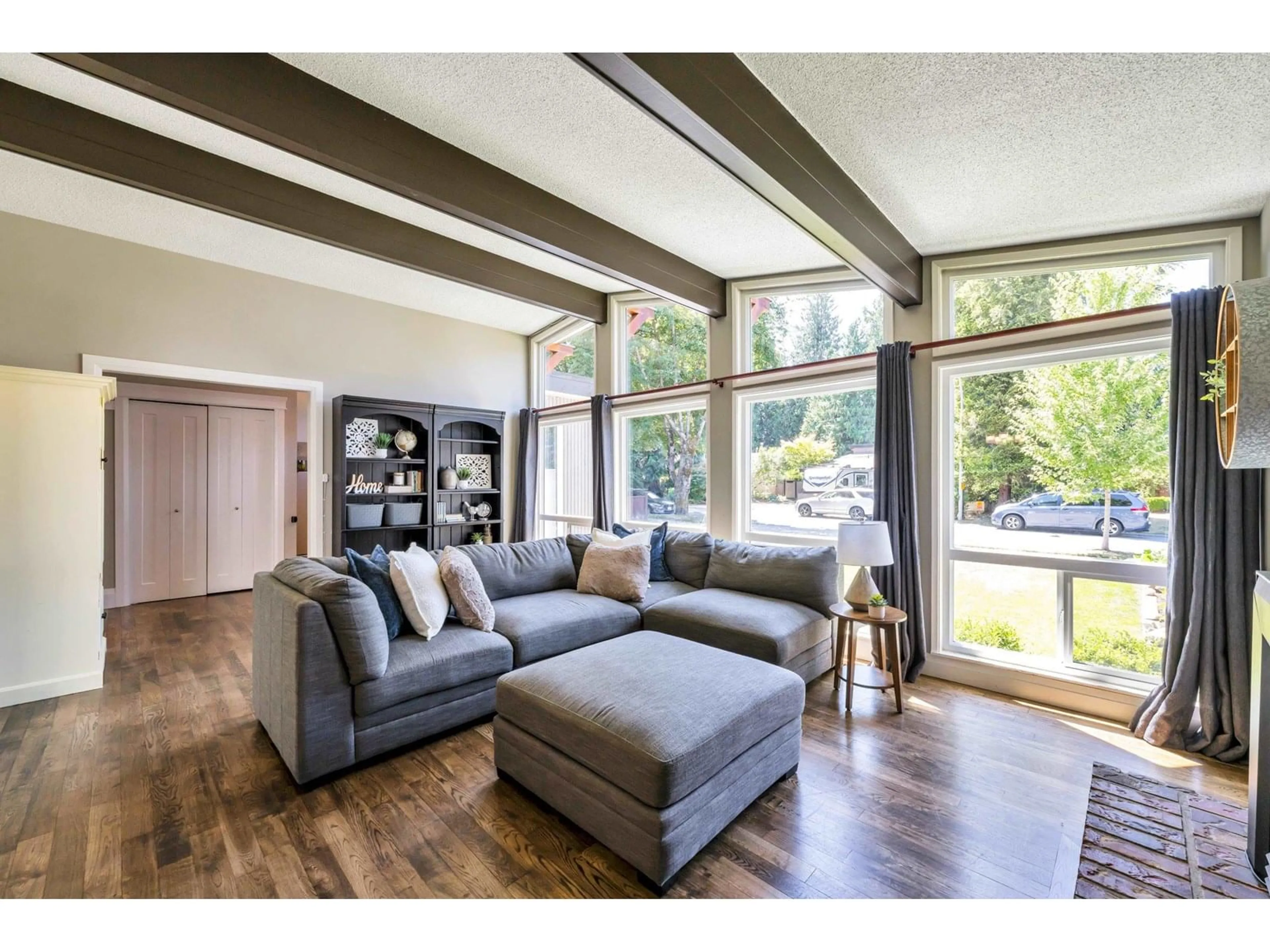 Living room with furniture, wood/laminate floor for 4520 206, Langley British Columbia V3A2B7