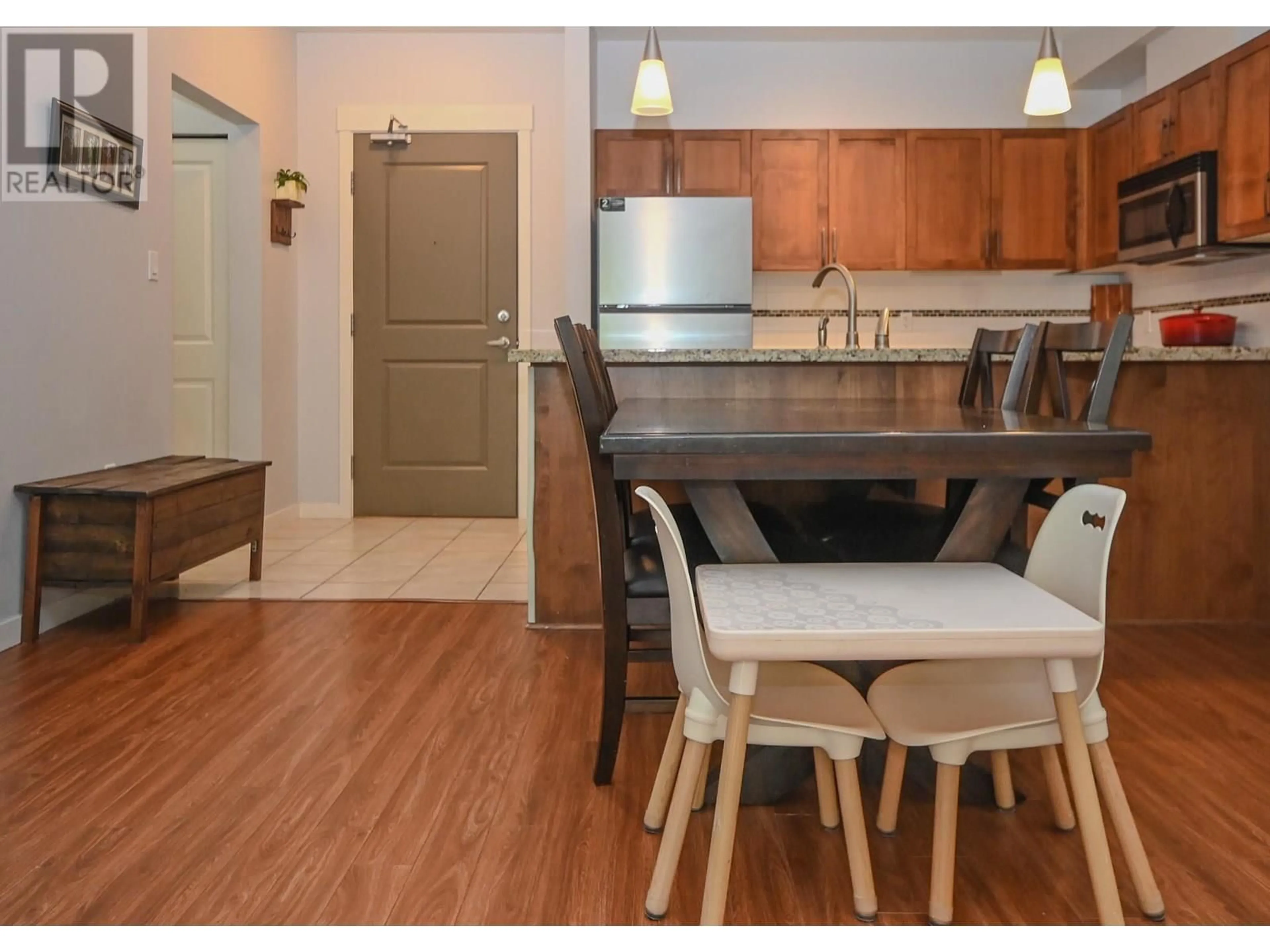 Open concept kitchen, wood/laminate floor for 221 - 12350 HARRIS ROAD, Pitt Meadows British Columbia V3Y0C5