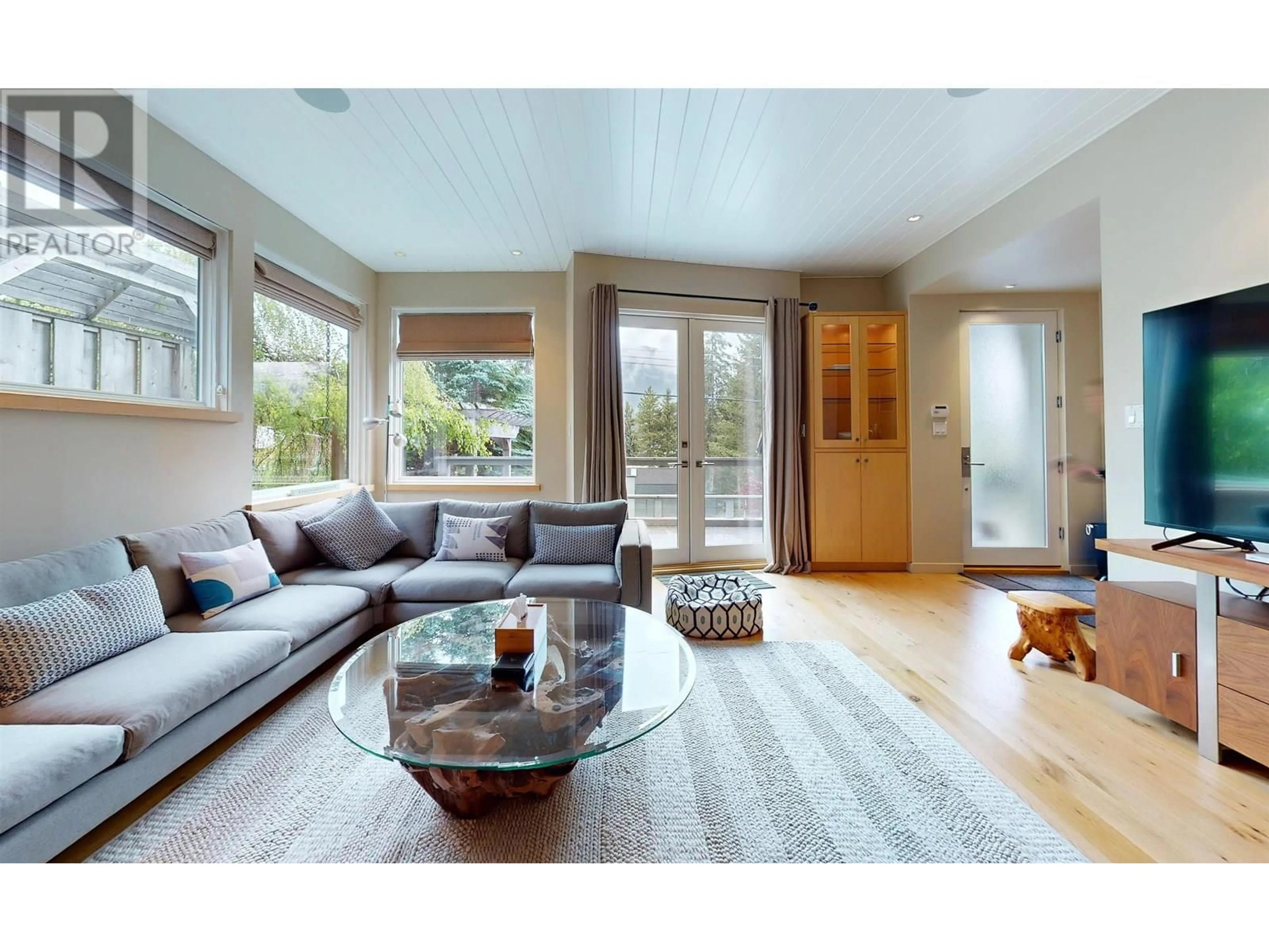 Living room with furniture, wood/laminate floor for 7410 AMBASSADOR CRESCENT, Whistler British Columbia V8E0E4