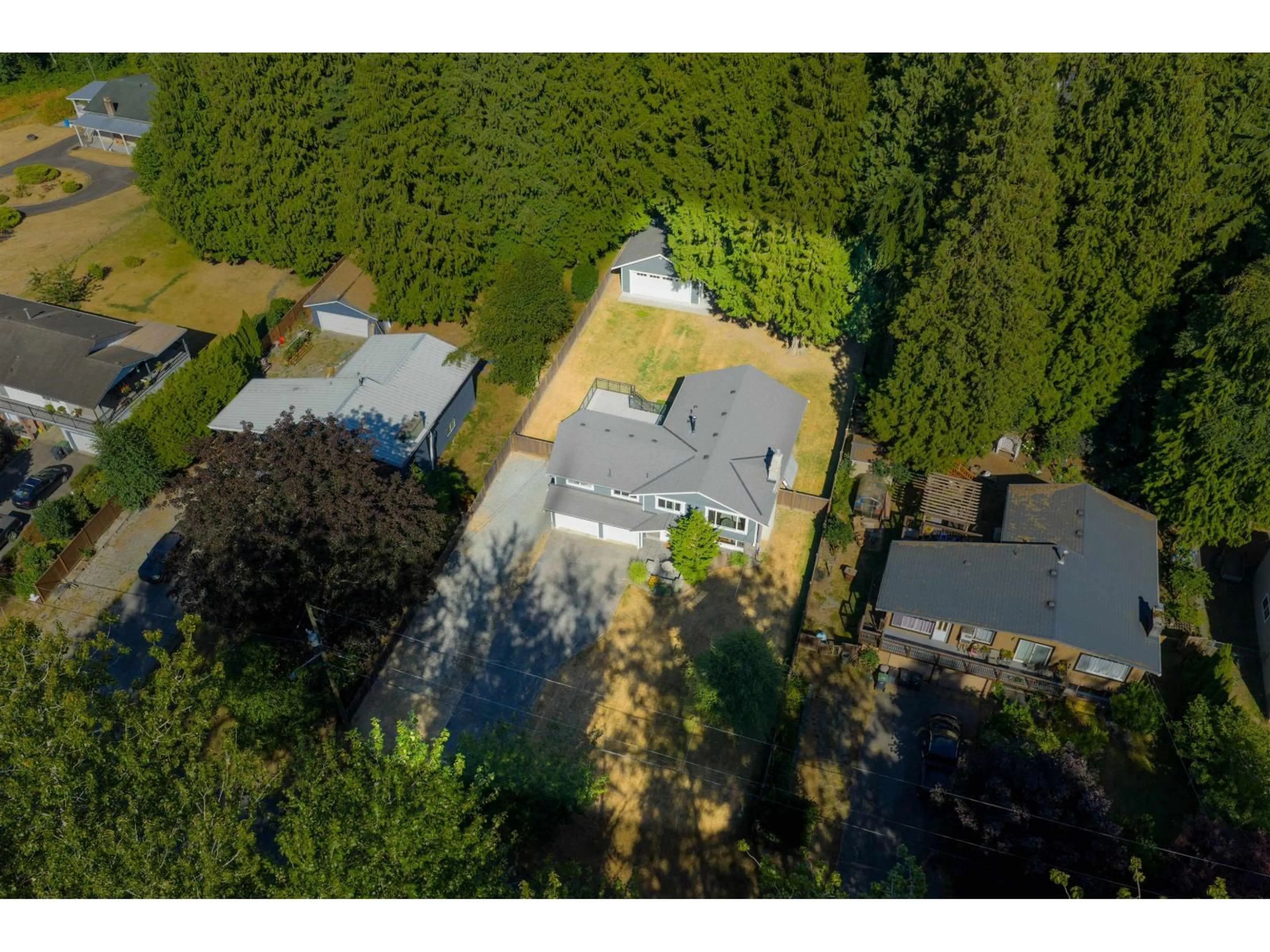 A pic from outside/outdoor area/front of a property/back of a property/a pic from drone, forest/trees view for 4278 196, Langley British Columbia V3A1A2