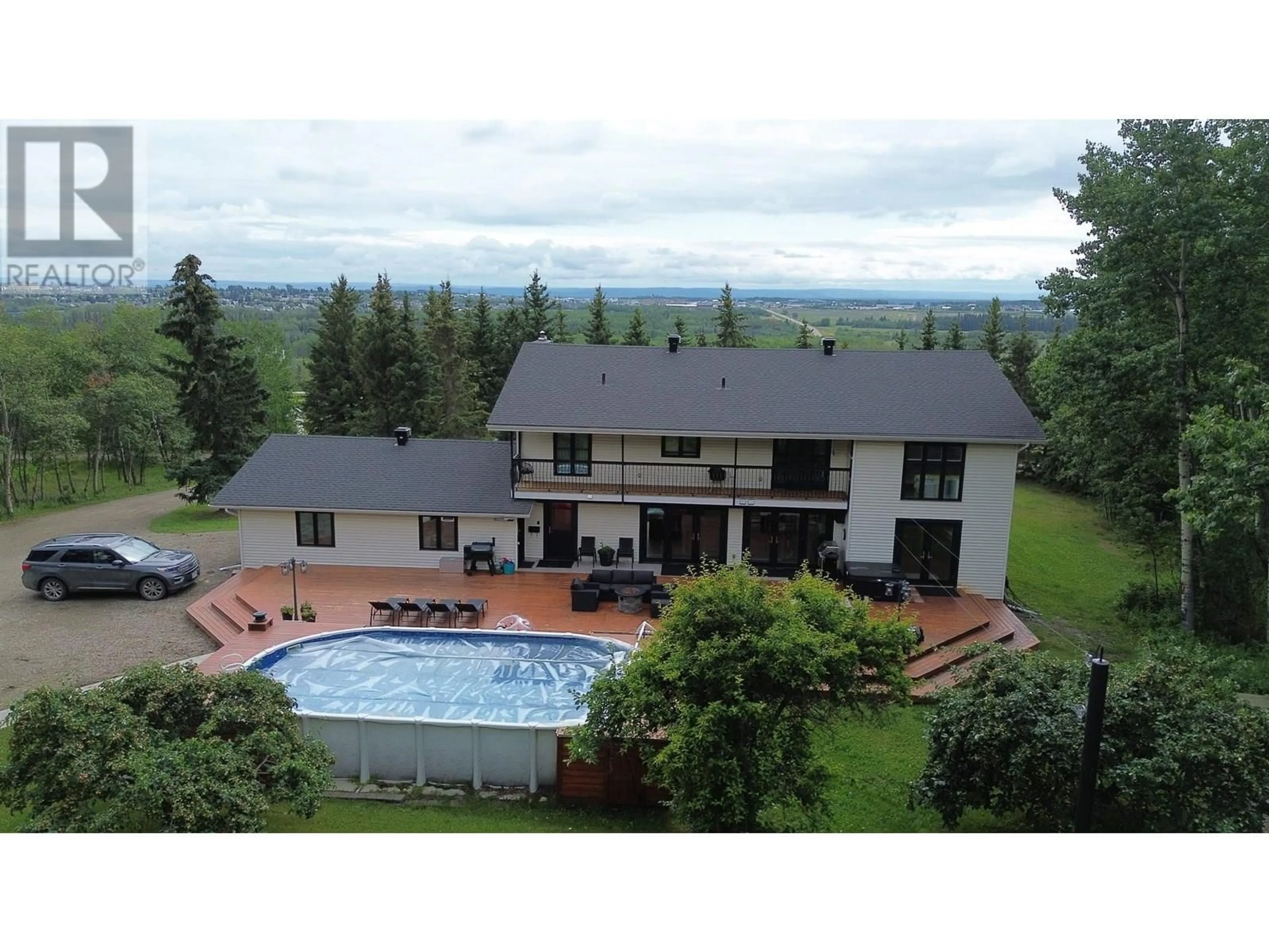 A pic from outside/outdoor area/front of a property/back of a property/a pic from drone, mountain view for 12583 267 ROAD, Fort St. John British Columbia V1J8J7