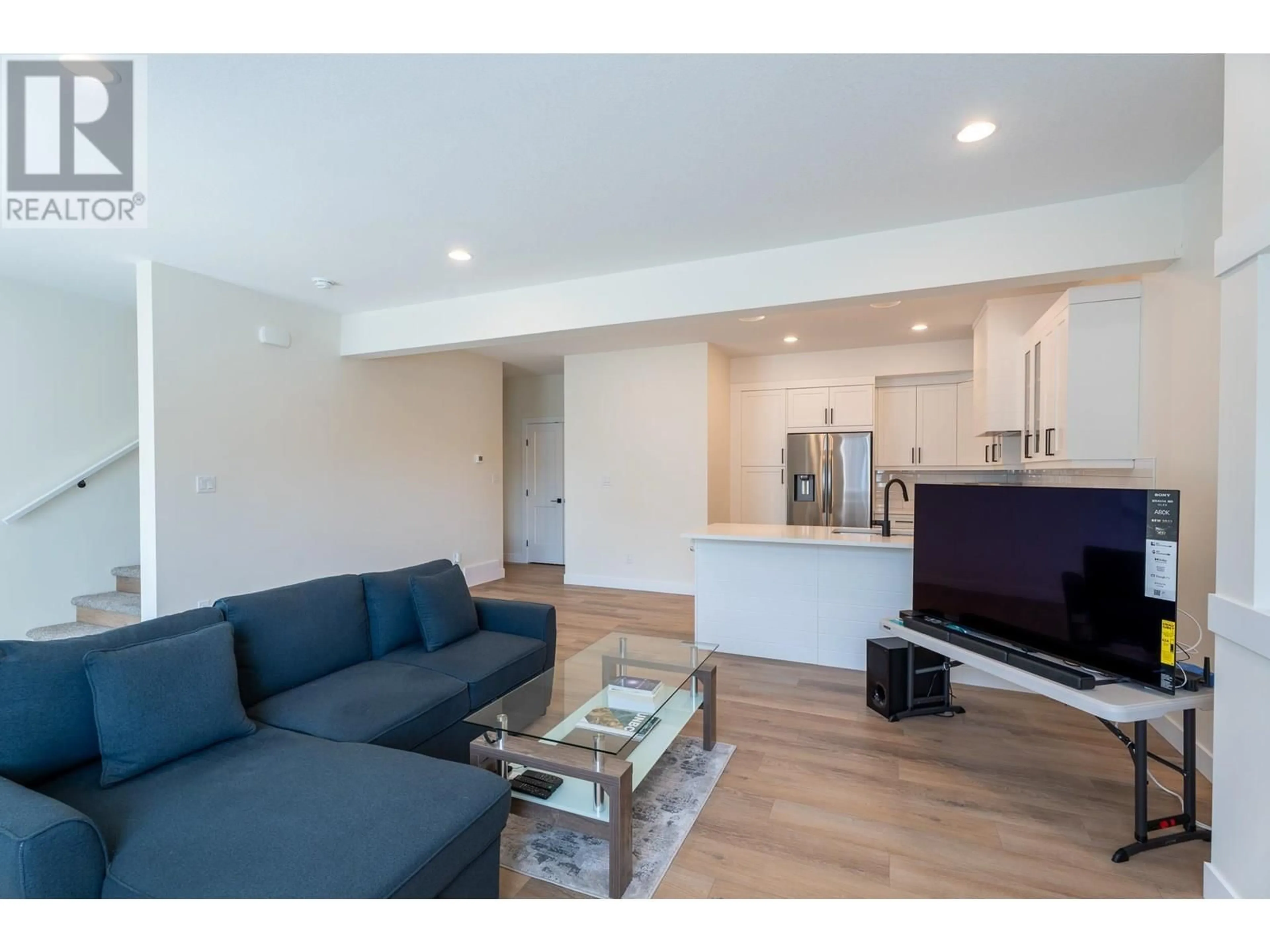 Living room with furniture, wood/laminate floor for 703 - 4274 22ND AVENUE, Prince George British Columbia V2N0J4