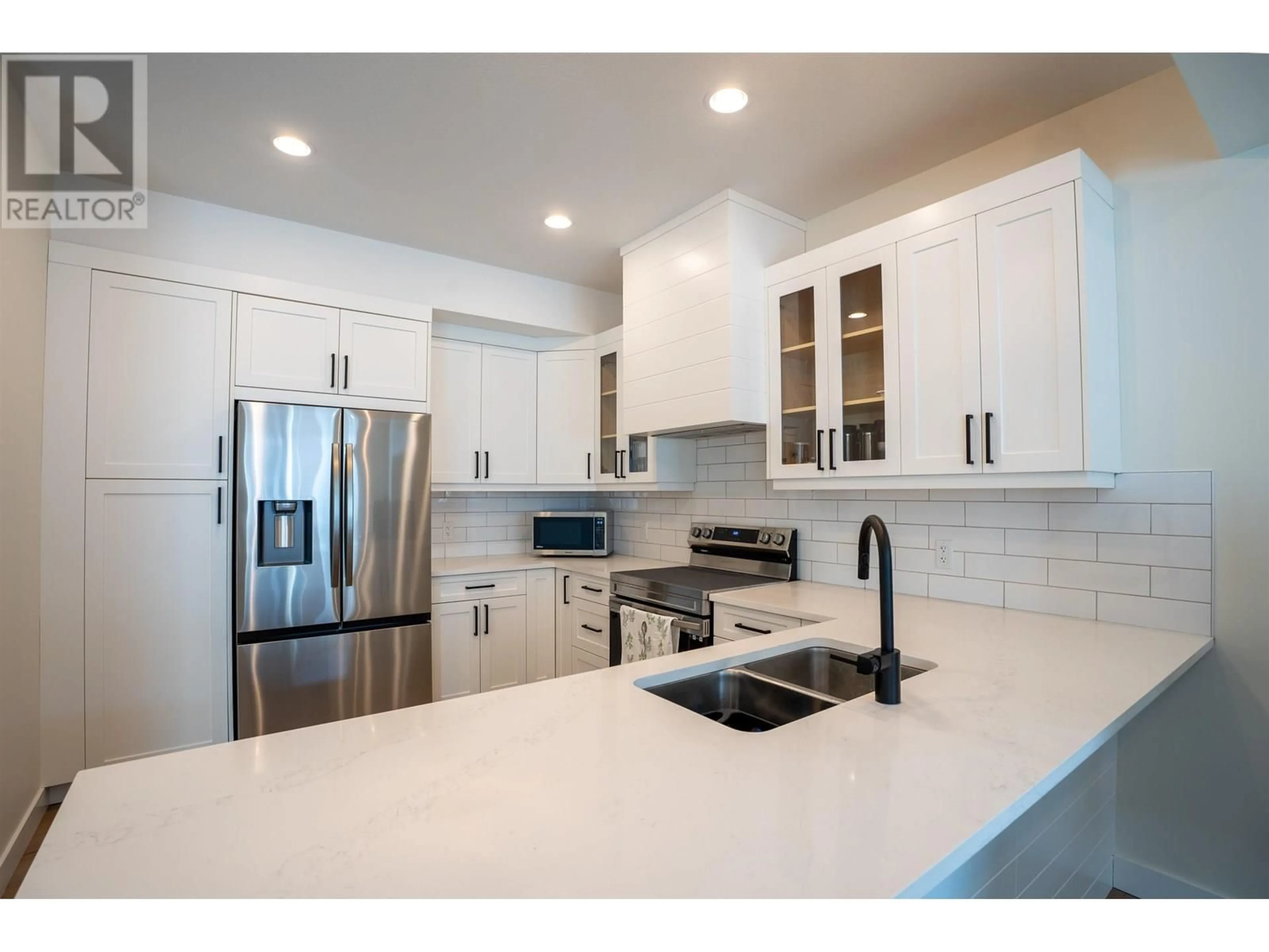 Open concept kitchen, ceramic/tile floor for 703 - 4274 22ND AVENUE, Prince George British Columbia V2N0J4