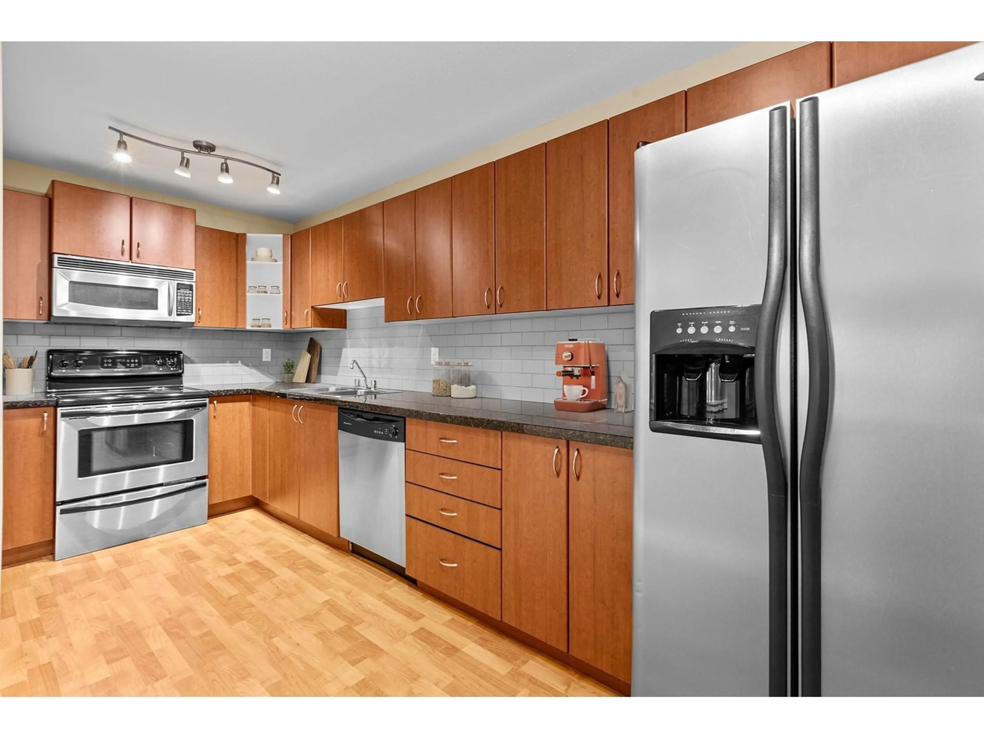 Standard kitchen, wood/laminate floor for 103 - 3063 IMMEL, Abbotsford British Columbia V2S4L3