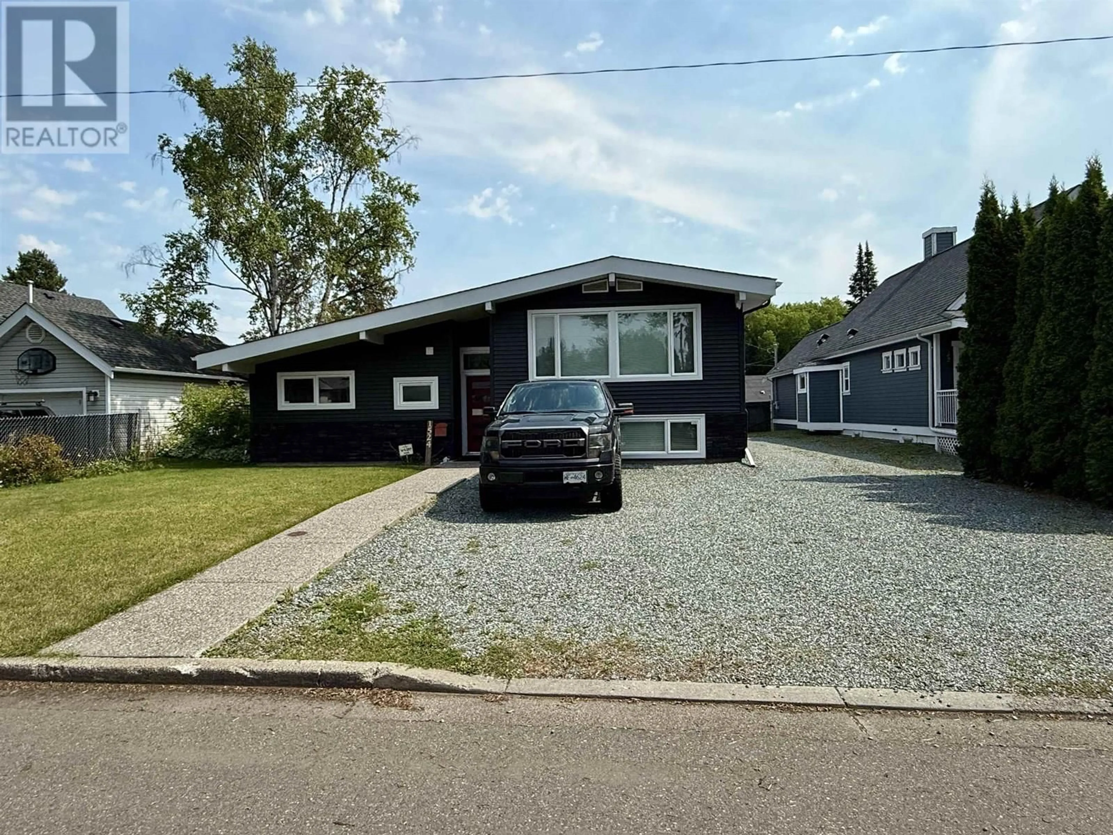 Home with vinyl exterior material, street for 1524 FIR STREET, Prince George British Columbia V2L1E4