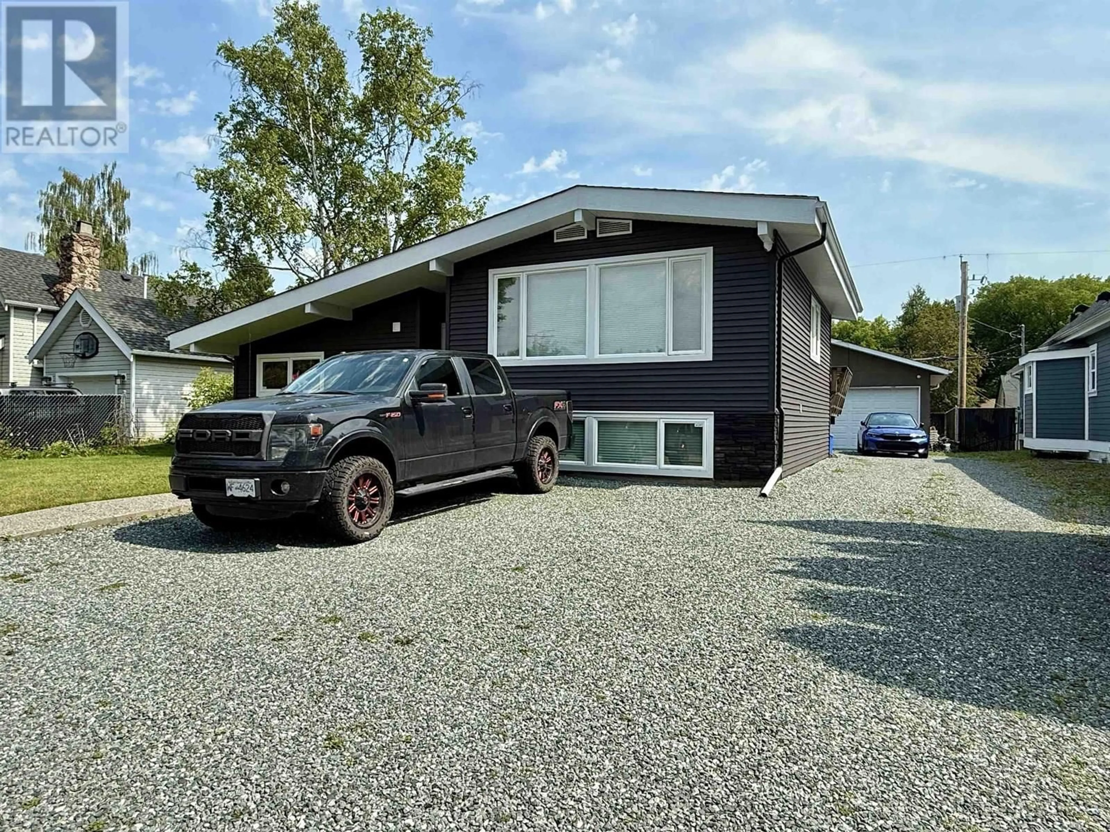 Home with vinyl exterior material, street for 1524 FIR STREET, Prince George British Columbia V2L1E4