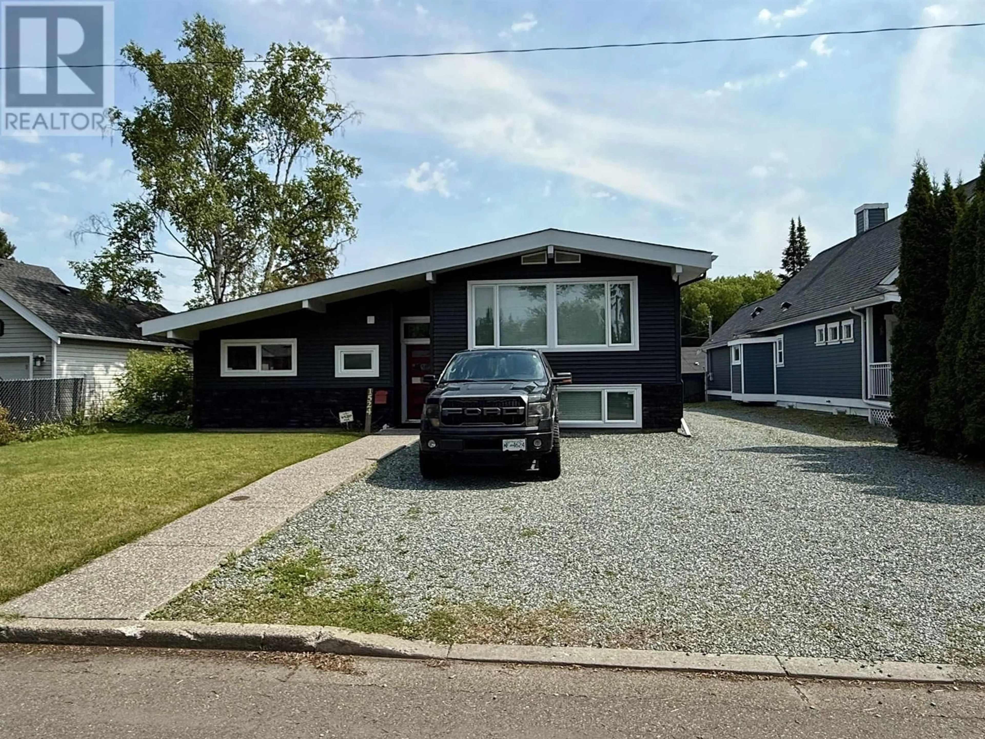 Home with vinyl exterior material, street for 1524 FIR STREET, Prince George British Columbia V2L1E4