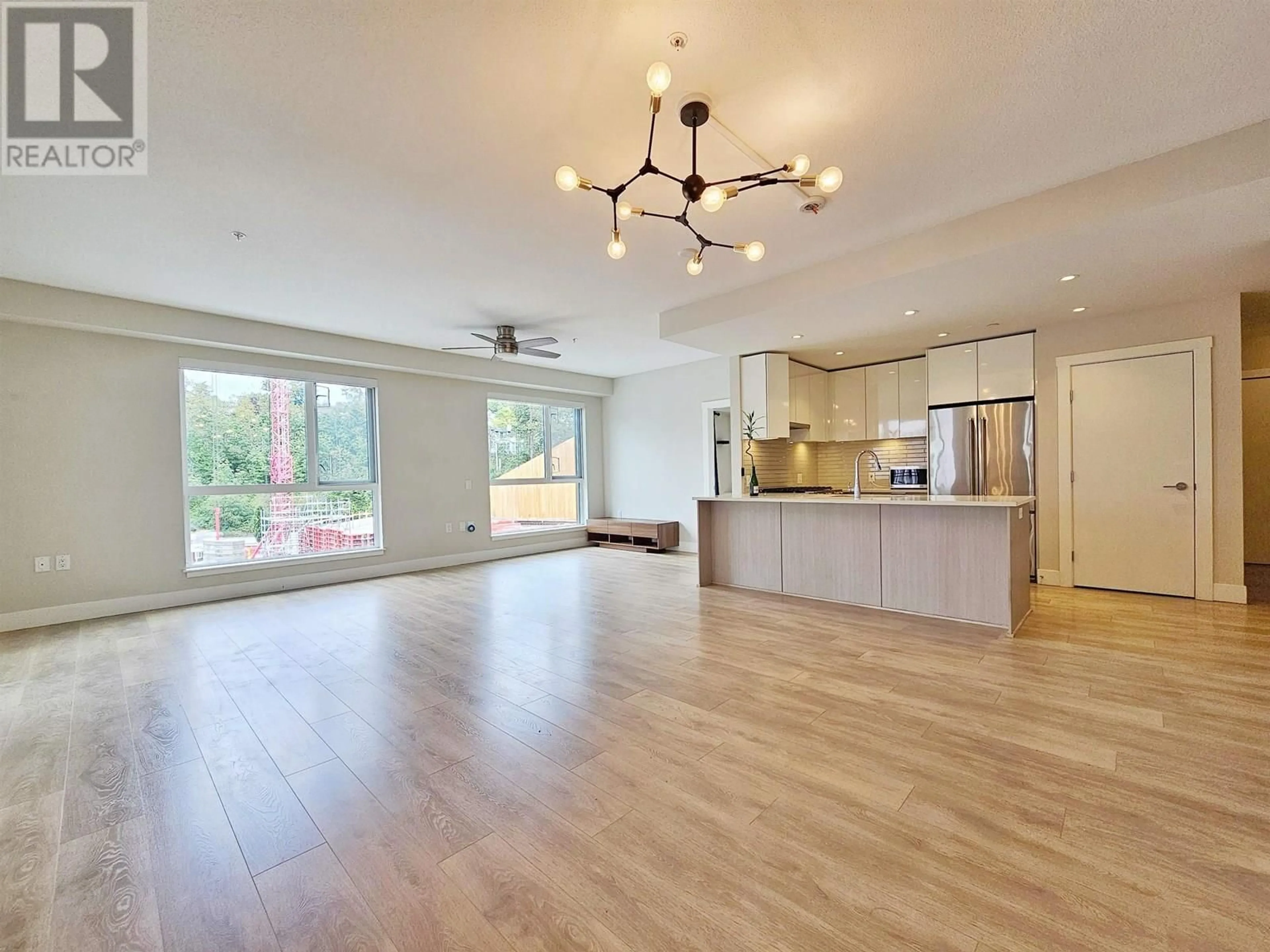 Open concept kitchen, wood/laminate floor for 405 - 8508 RIVERGRASS DRIVE, Vancouver British Columbia V5S0H7