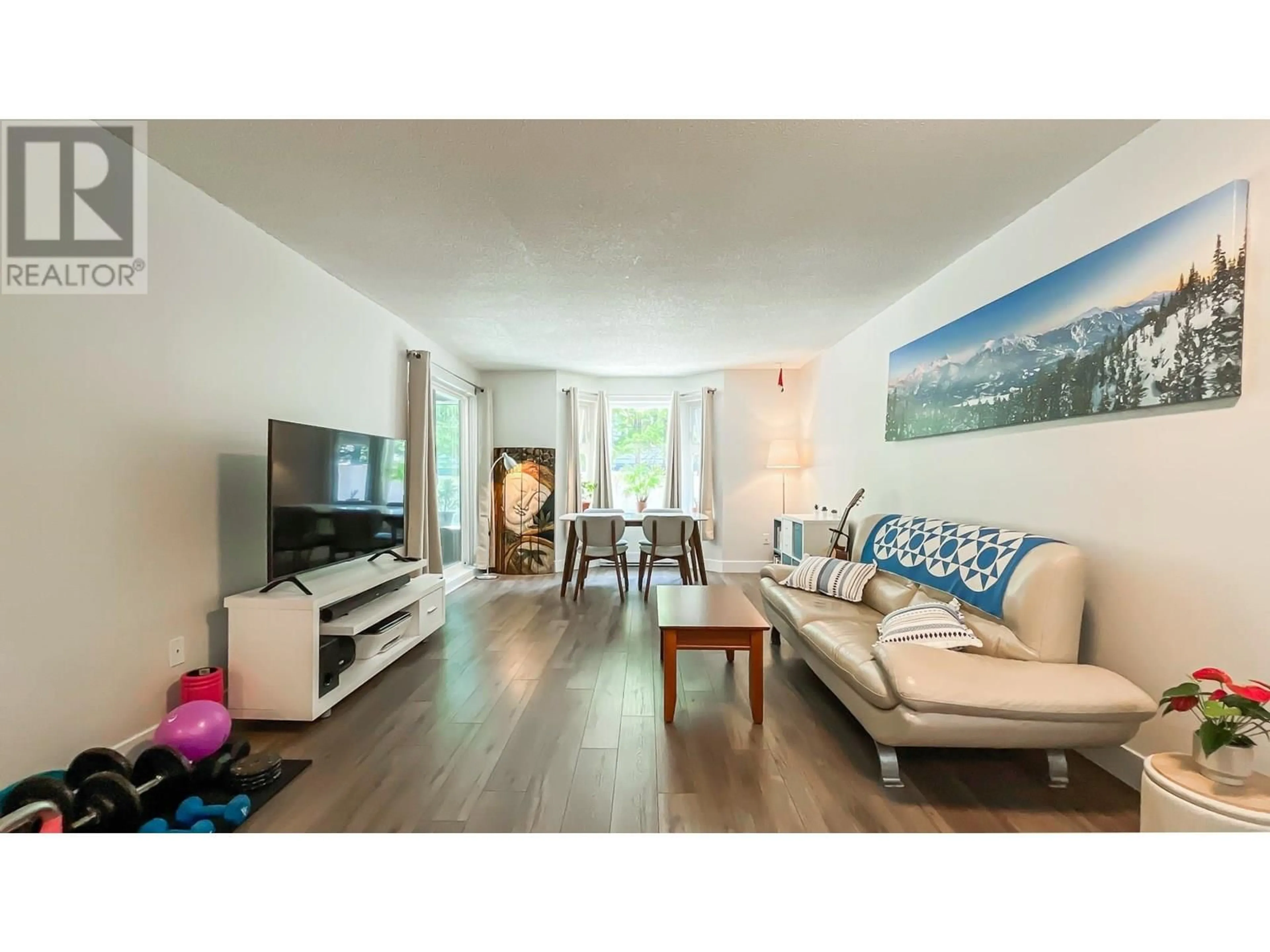 Living room with furniture, wood/laminate floor for 107 - 1169 EIGHTH AVENUE, New Westminster British Columbia V3M2R7