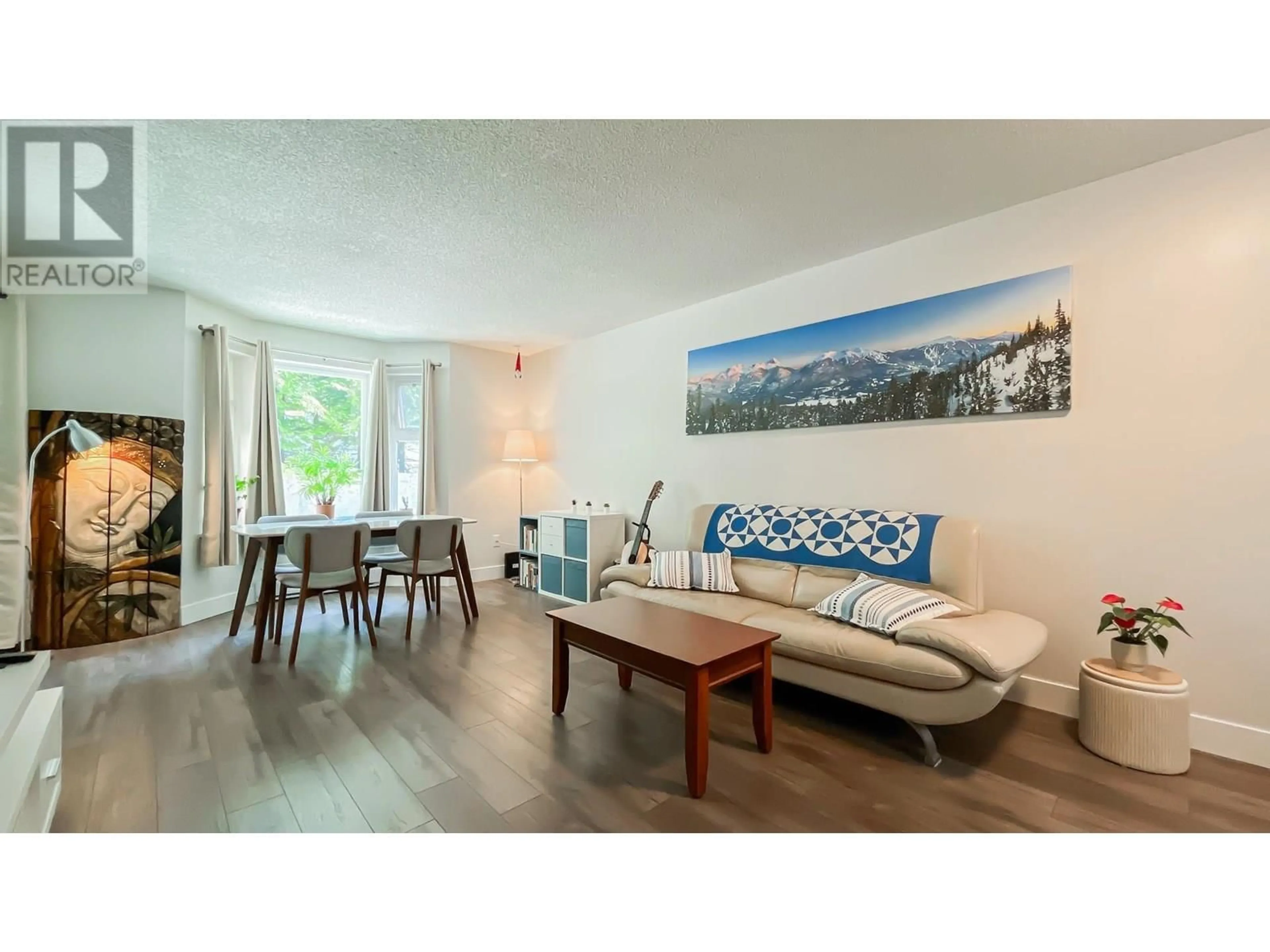 Living room with furniture, wood/laminate floor for 107 - 1169 EIGHTH AVENUE, New Westminster British Columbia V3M2R7