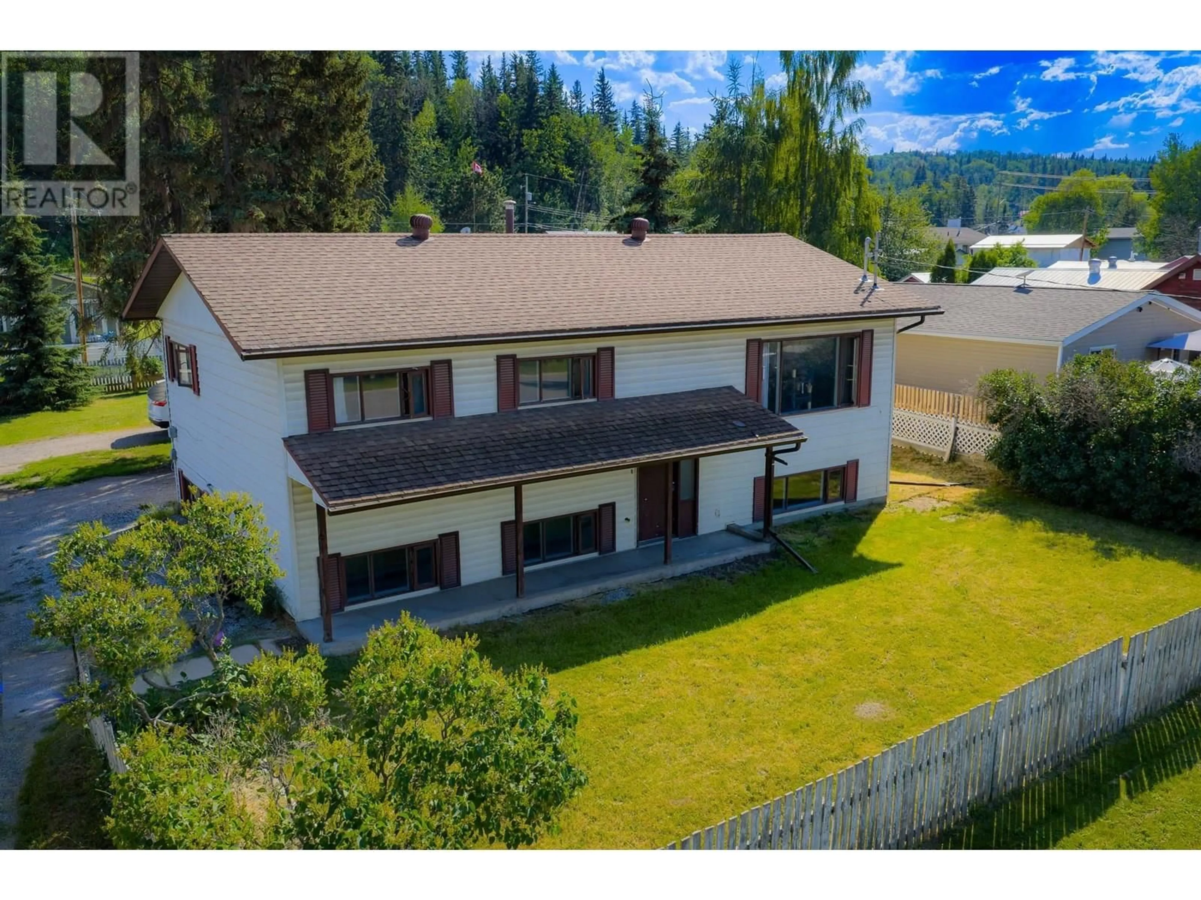 A pic from outside/outdoor area/front of a property/back of a property/a pic from drone, mountain view for 218 3RD STREET, Vanderhoof British Columbia V0J3A0