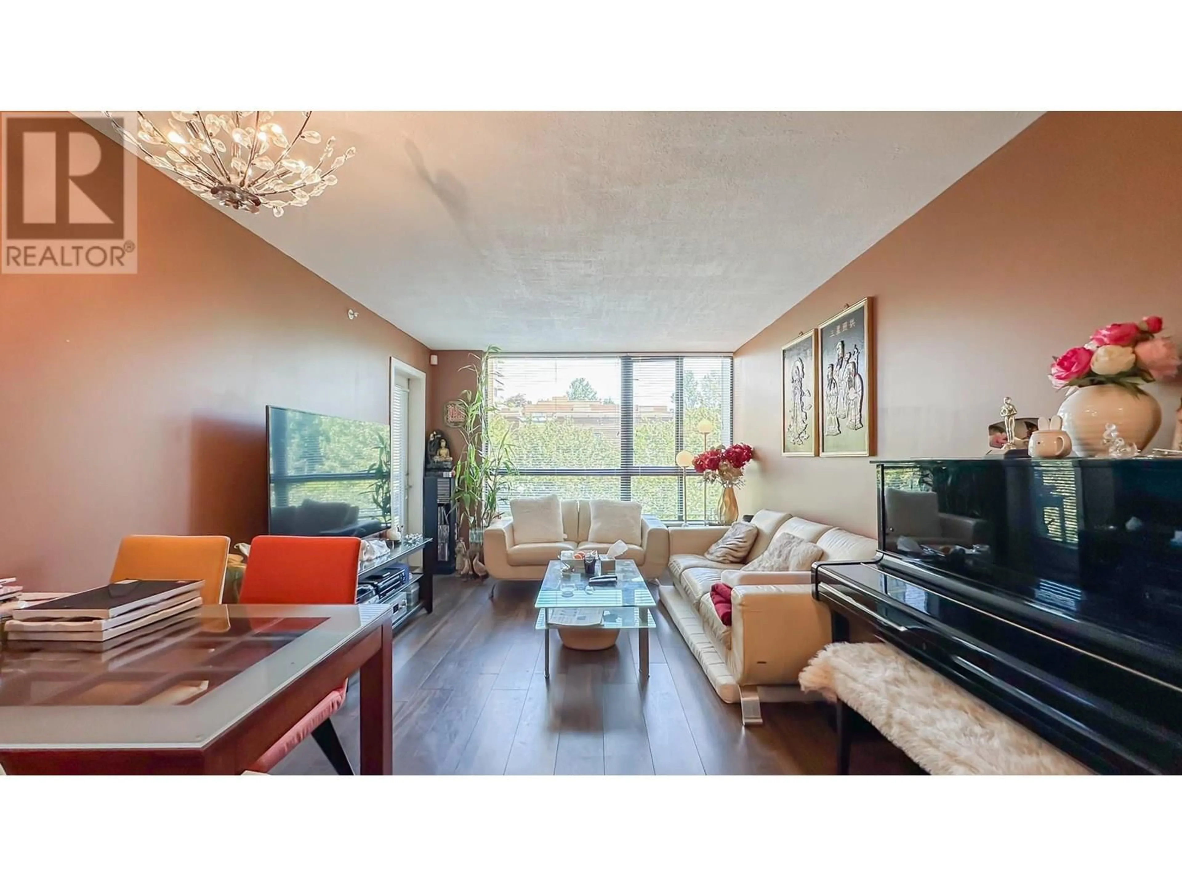 Living room with furniture, wood/laminate floor for 401 - 3588 CROWLEY DRIVE, Vancouver British Columbia V5R6H3