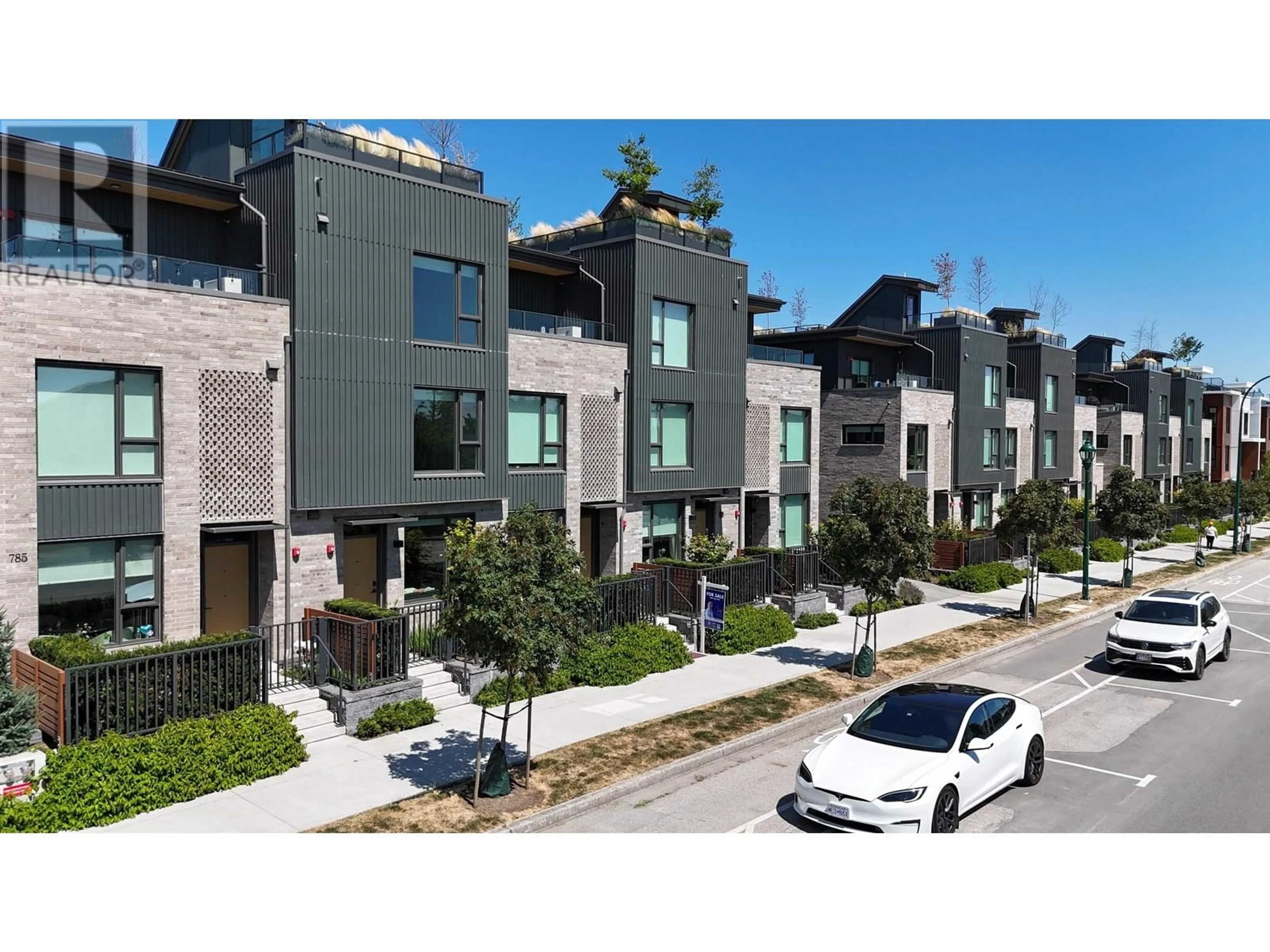 A pic from outside/outdoor area/front of a property/back of a property/a pic from drone, street for 153 - 785 49TH AVENUE, Vancouver British Columbia V5Z2S6