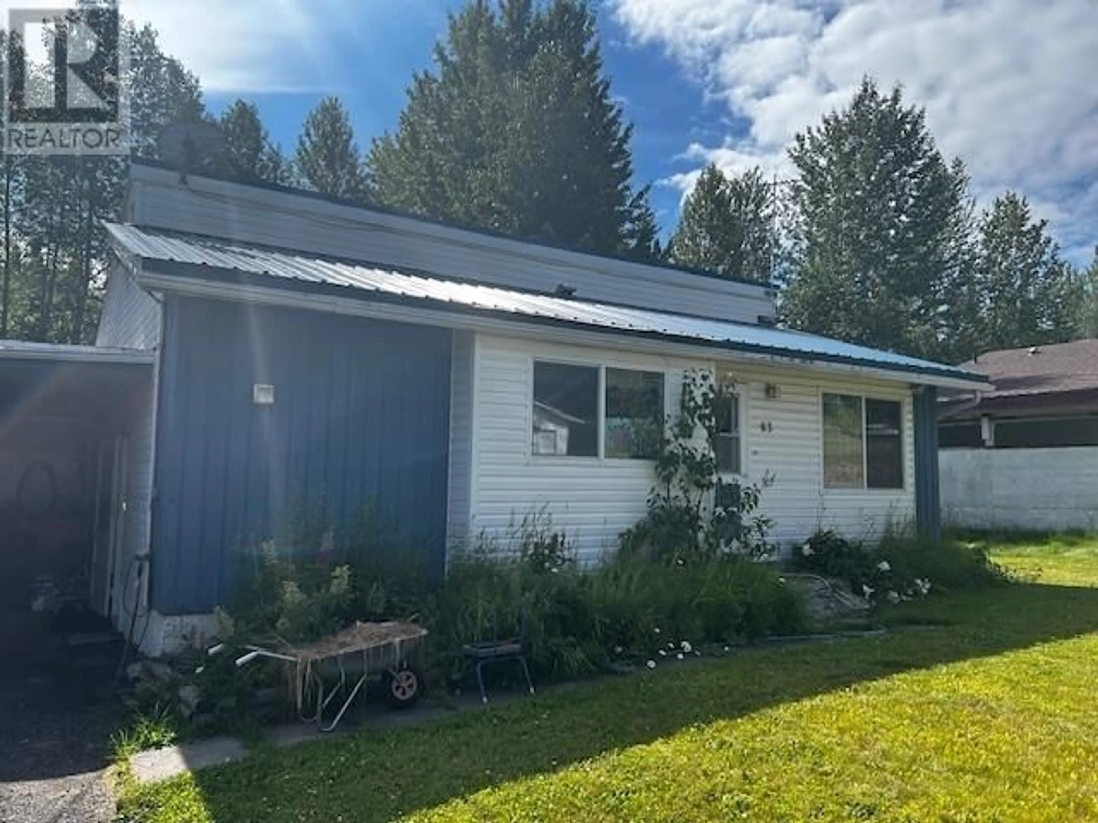 Home with vinyl exterior material, street for 63 MORRISON STREET, Granisle British Columbia V0J1W0