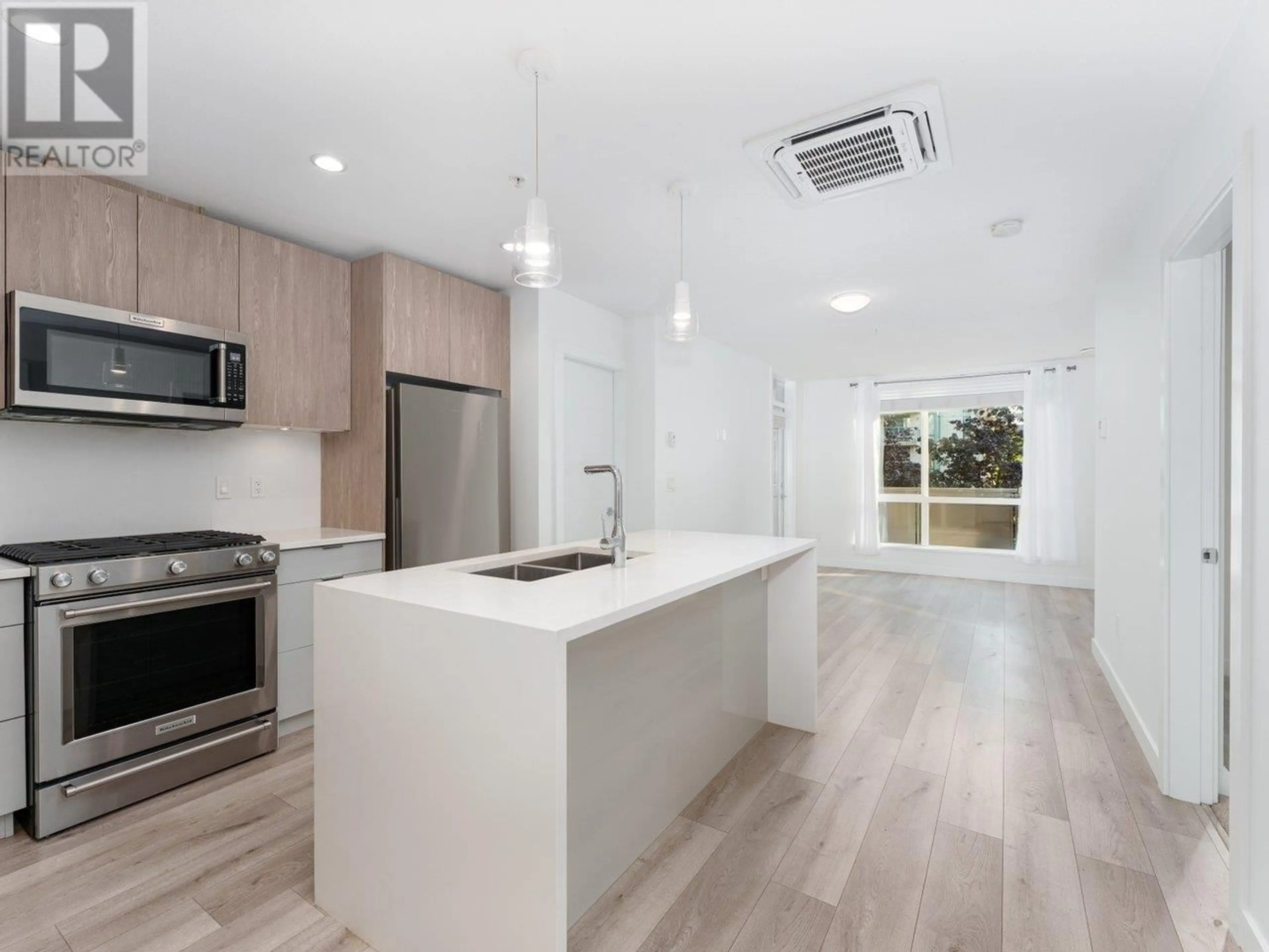 Open concept kitchen, unknown for 202 - 128 8TH STREET, North Vancouver British Columbia V7L1Y7
