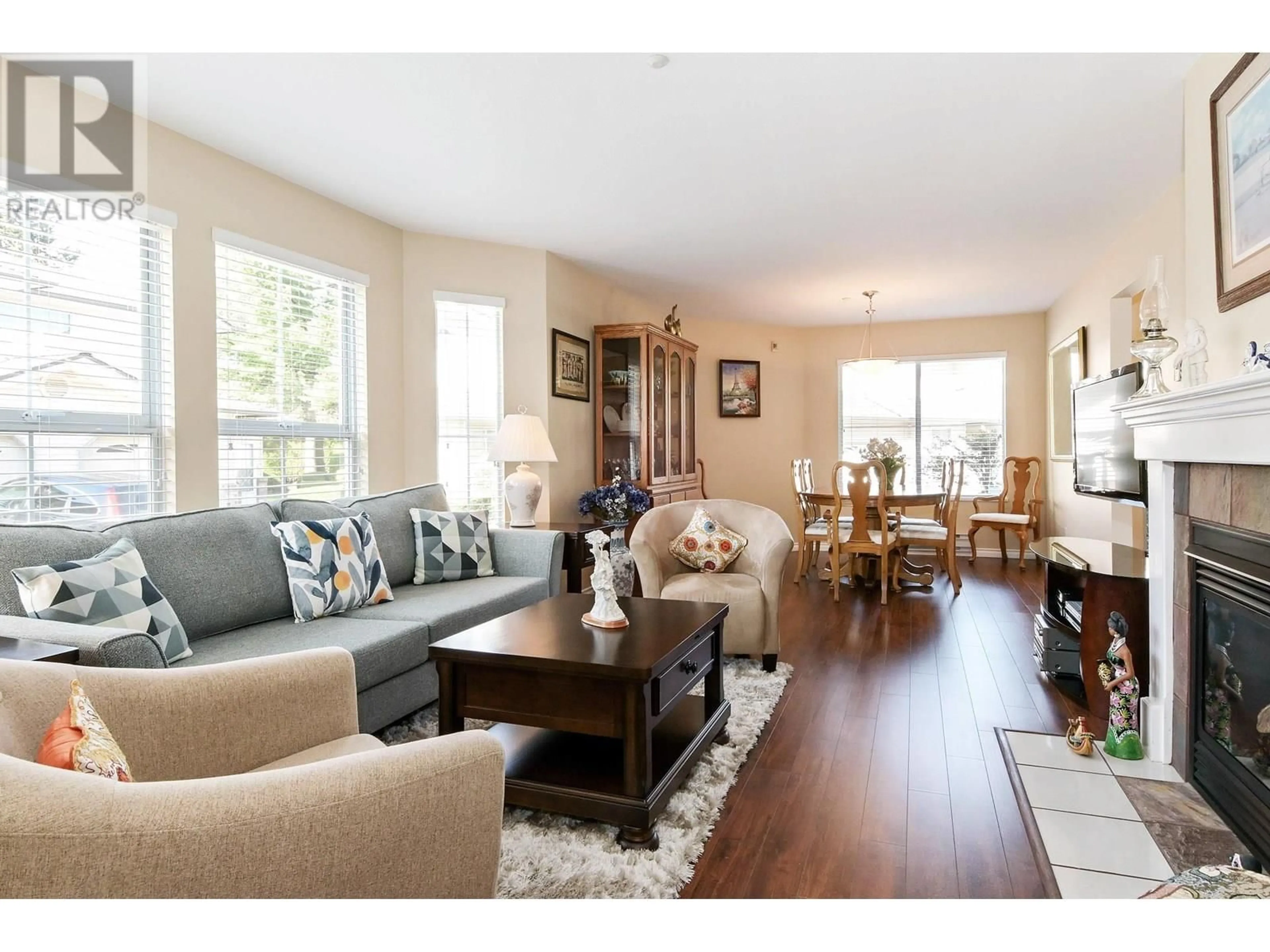 Living room with furniture, wood/laminate floor for 7 - 19060 FORD ROAD, Pitt Meadows British Columbia V3Y2M2