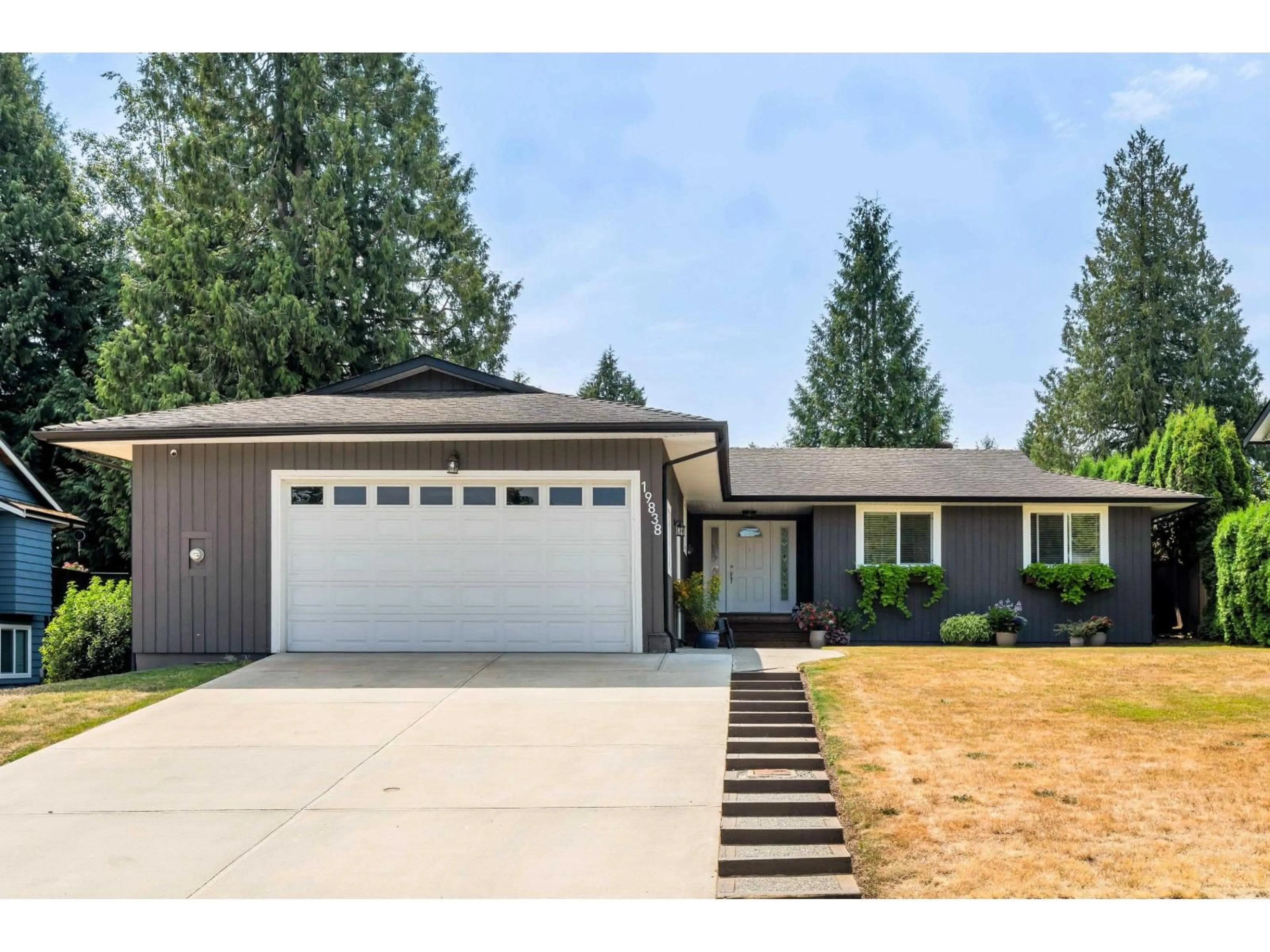 Home with vinyl exterior material, street for 19838 48A, Langley British Columbia V3A6Y2