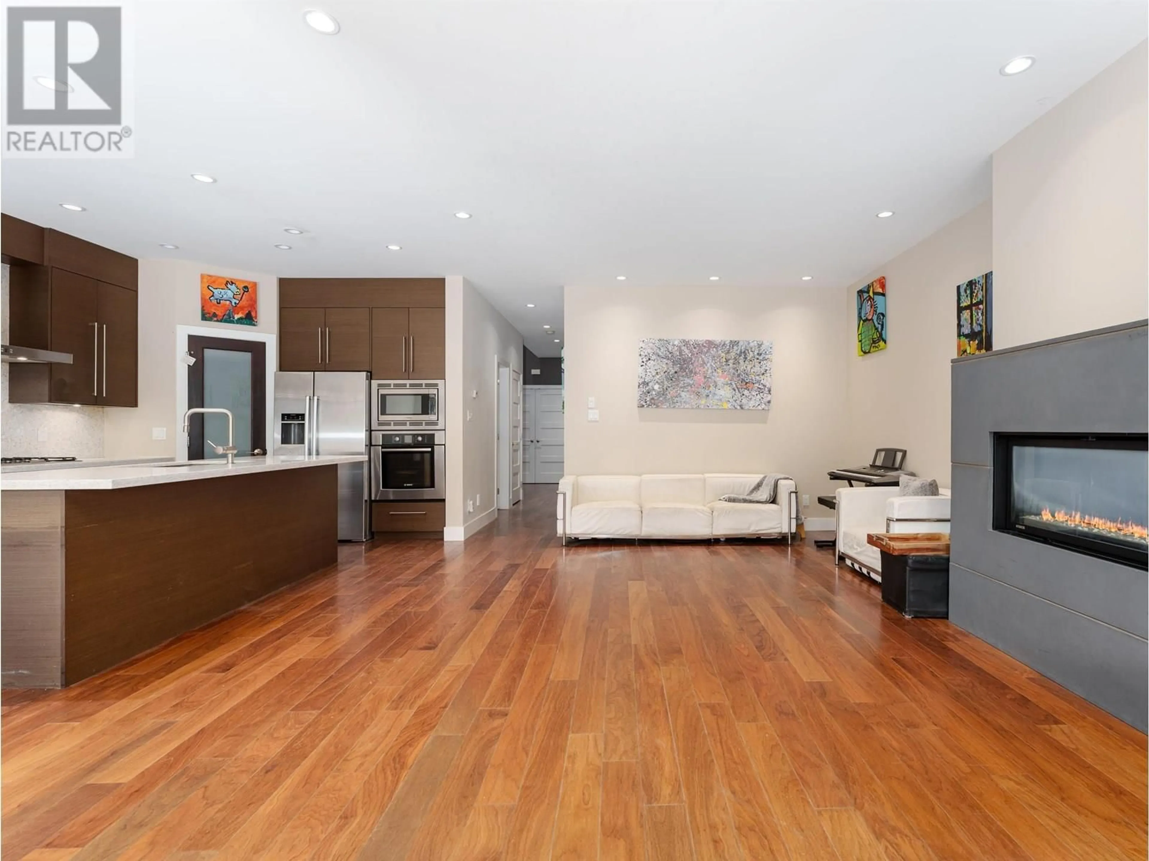 Open concept kitchen, wood/laminate floor for 3660 GEORGIA STREET, Richmond British Columbia V7E2S1