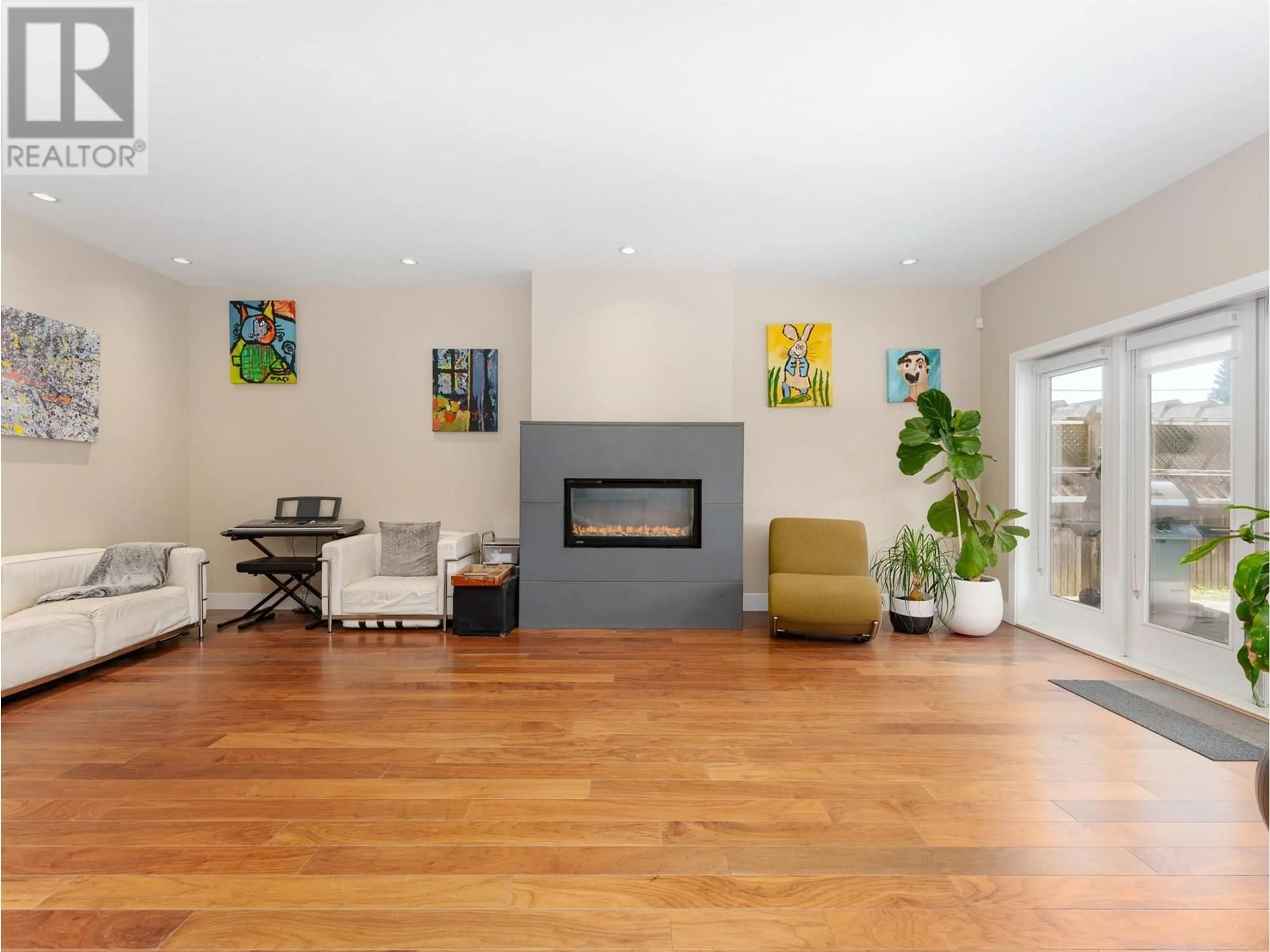 Living room with furniture, wood/laminate floor for 3660 GEORGIA STREET, Richmond British Columbia V7E2S1
