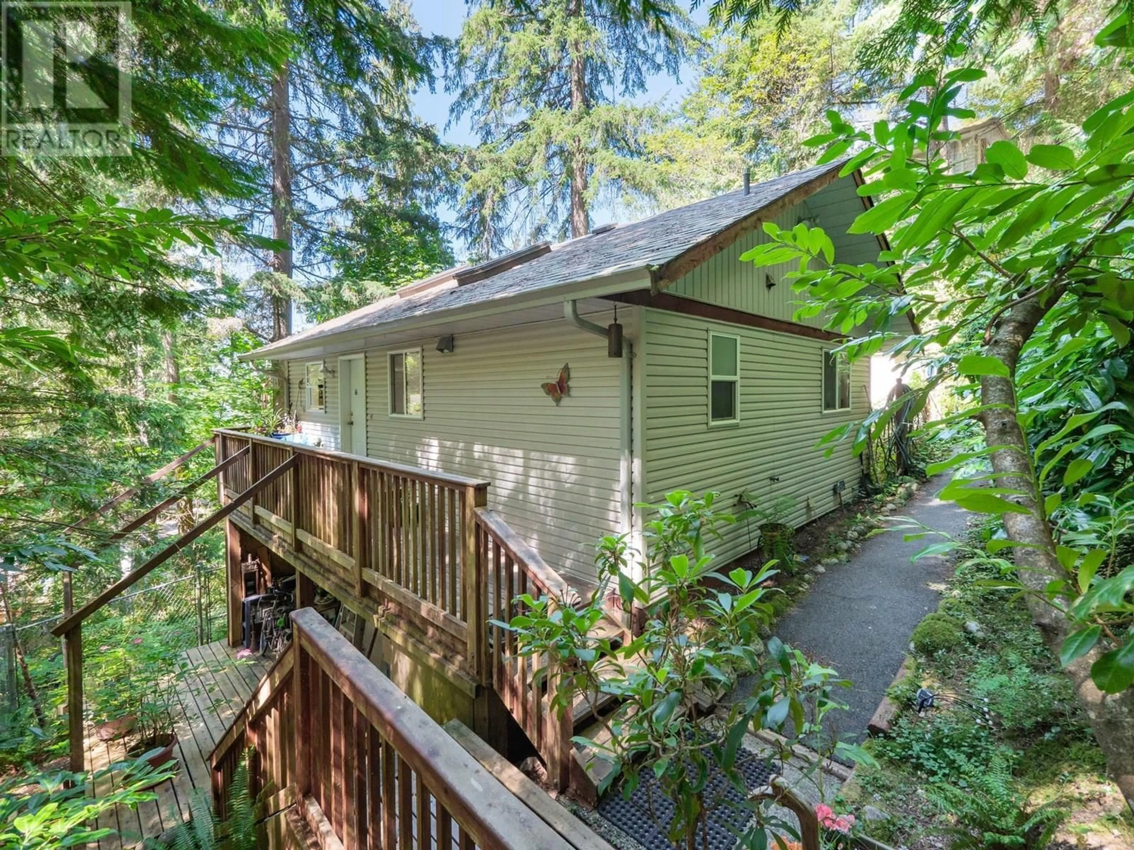 A pic from outside/outdoor area/front of a property/back of a property/a pic from drone, forest/trees view for 7027 SKANA CRESCENT, Sechelt British Columbia V7Z0C8