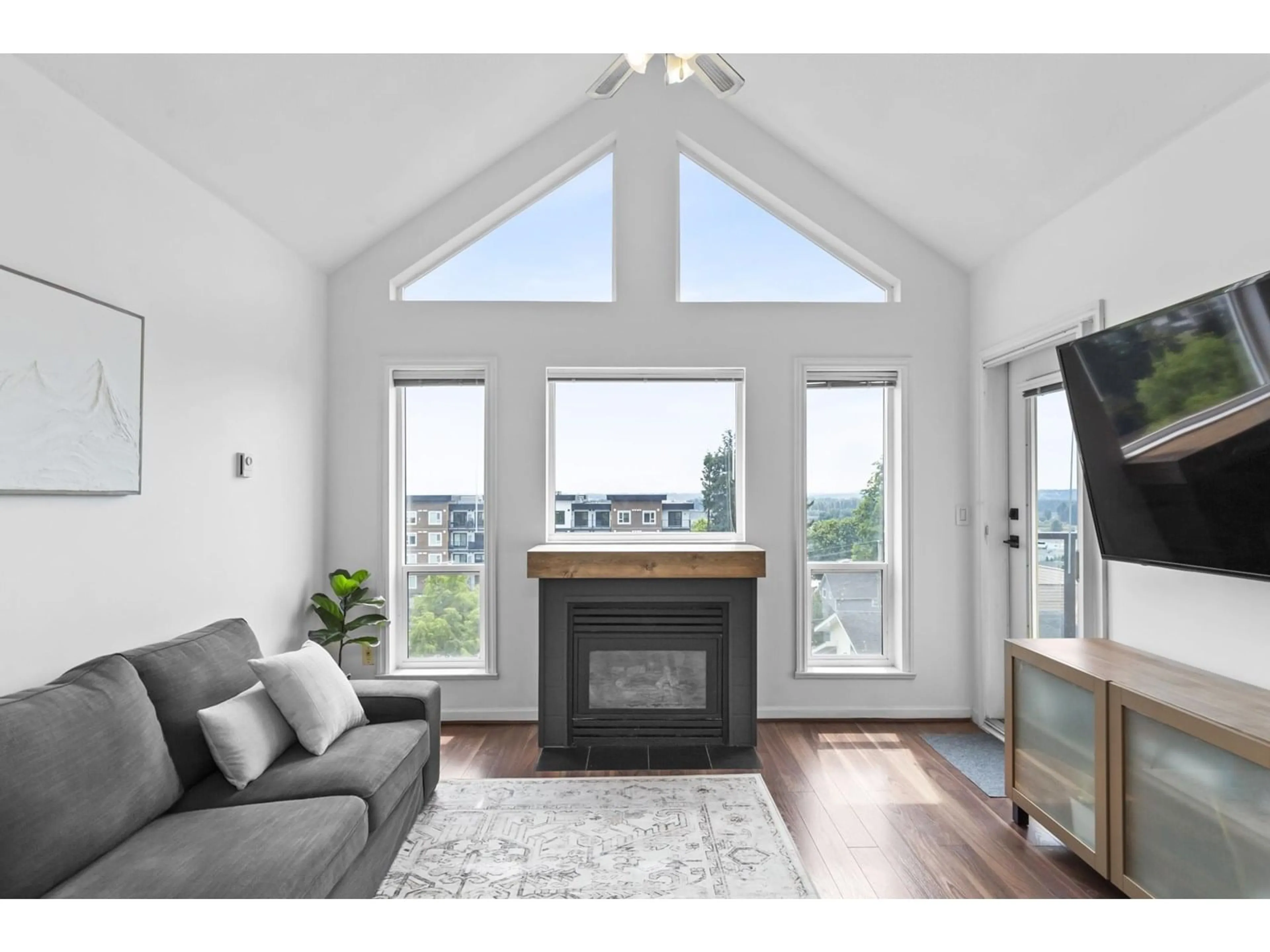 Living room with furniture, wood/laminate floor for 311 - 33150 4, Mission British Columbia V2V7A3