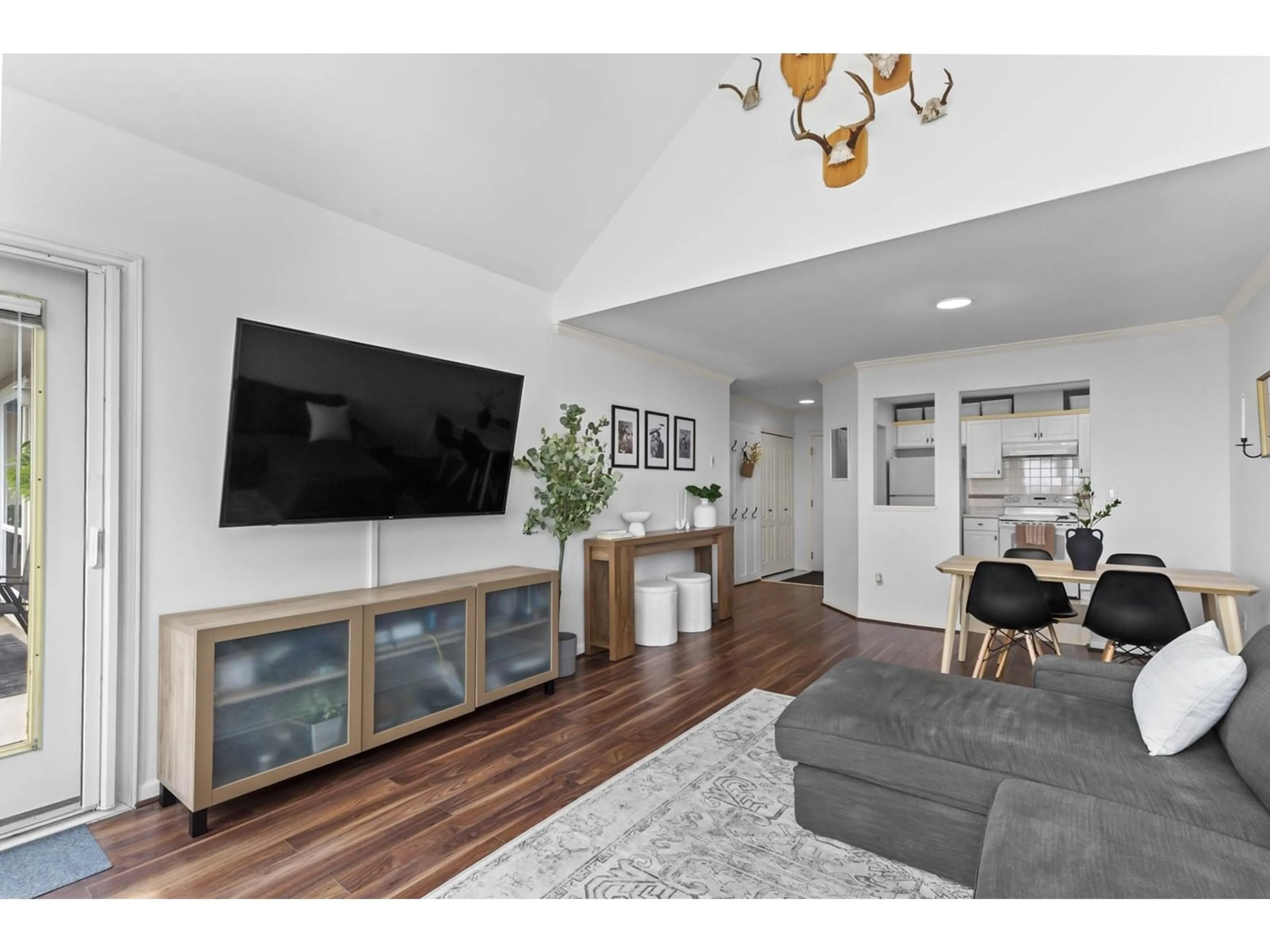 Living room with furniture, wood/laminate floor for 311 - 33150 4, Mission British Columbia V2V7A3