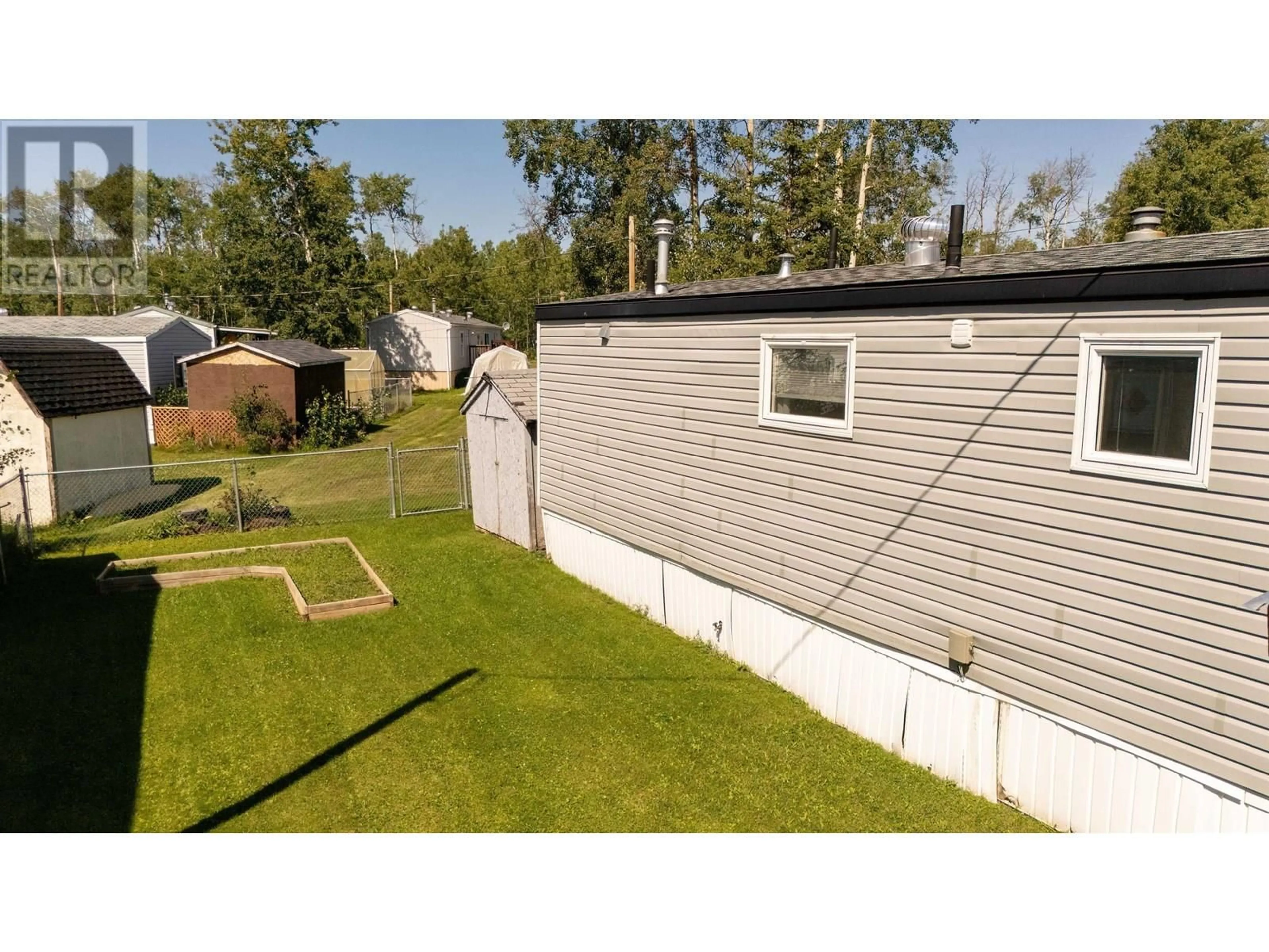 A pic from outside/outdoor area/front of a property/back of a property/a pic from drone, unknown for 8 - 7414 FOREST LAWN STREET, Fort St. John British Columbia V1J8B7