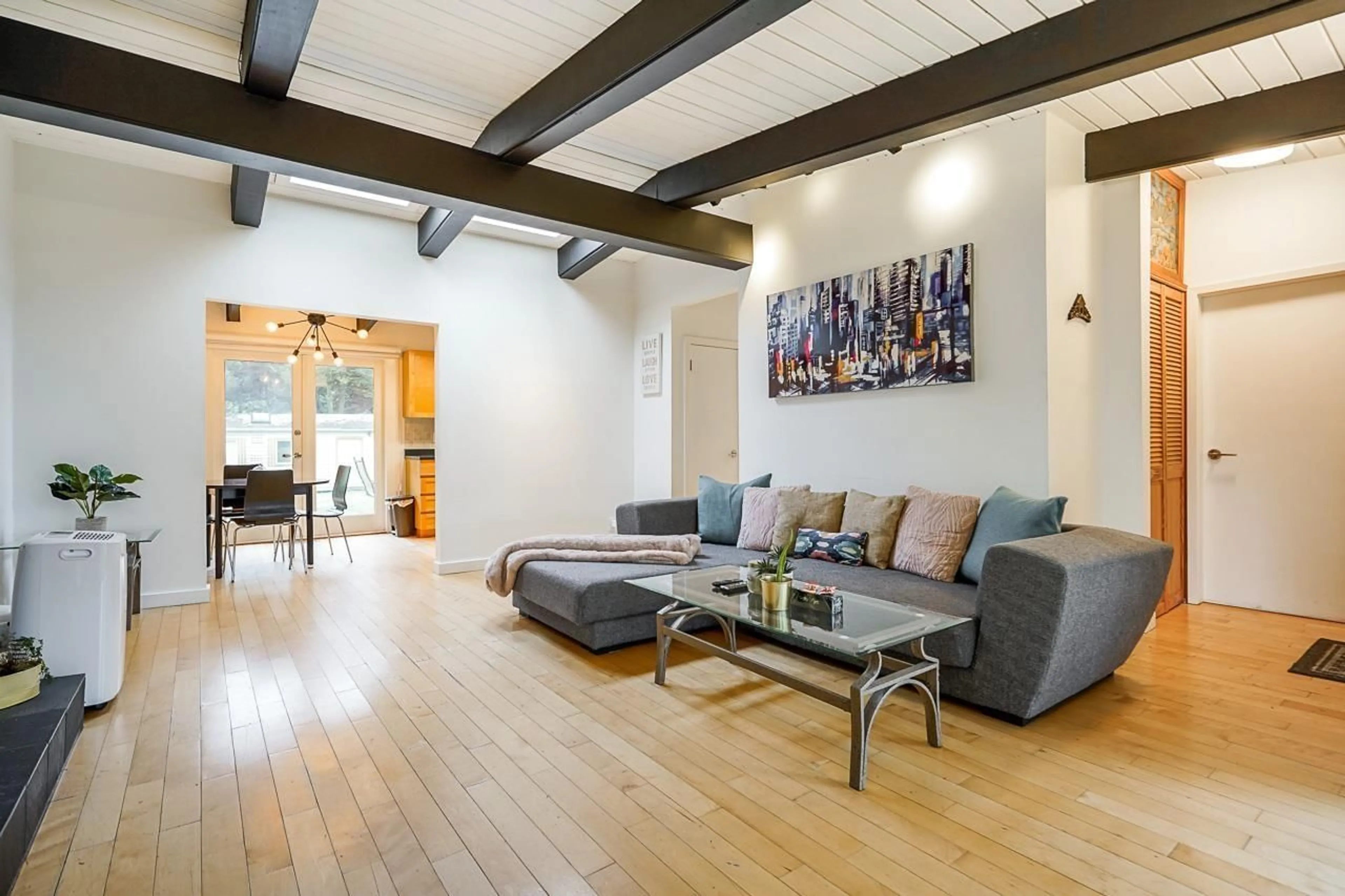 Living room with furniture, wood/laminate floor for 14352 110 AVENUE, Surrey British Columbia V3R2A2