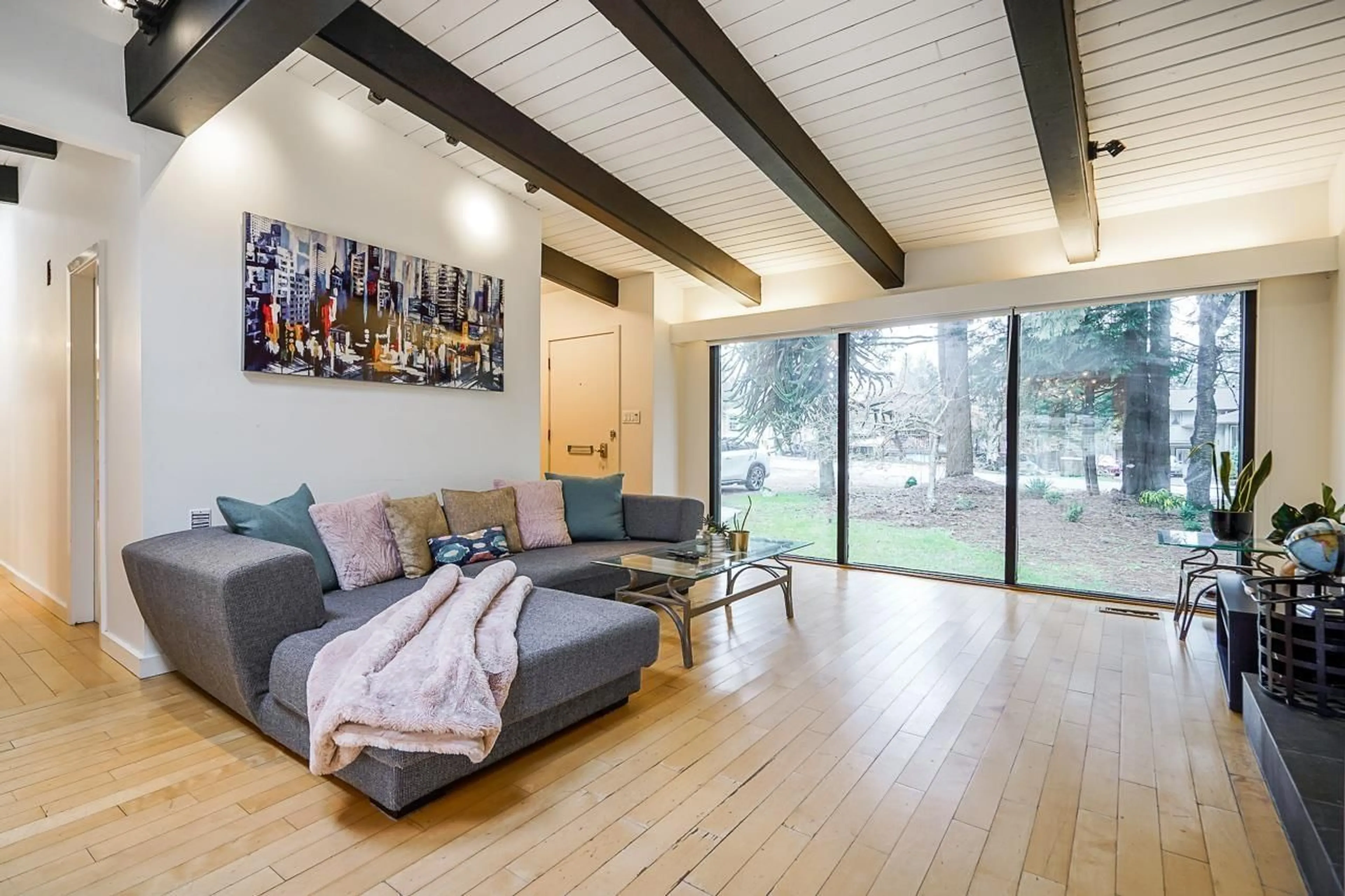 Living room with furniture, wood/laminate floor for 14352 110 AVENUE, Surrey British Columbia V3R2A2