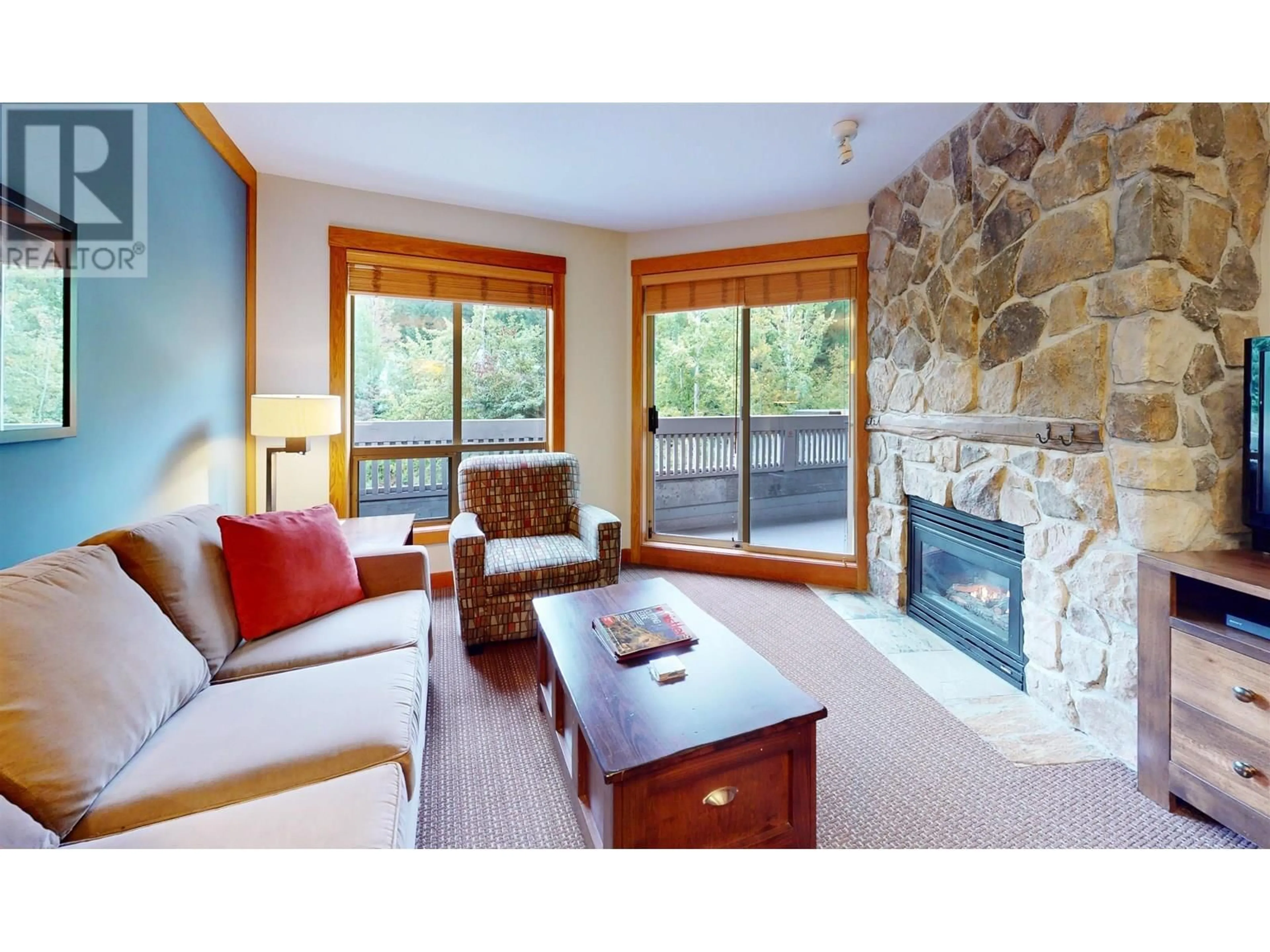Living room with furniture, wood/laminate floor for 218B - 2036 LONDON LANE, Whistler British Columbia V8E0N7