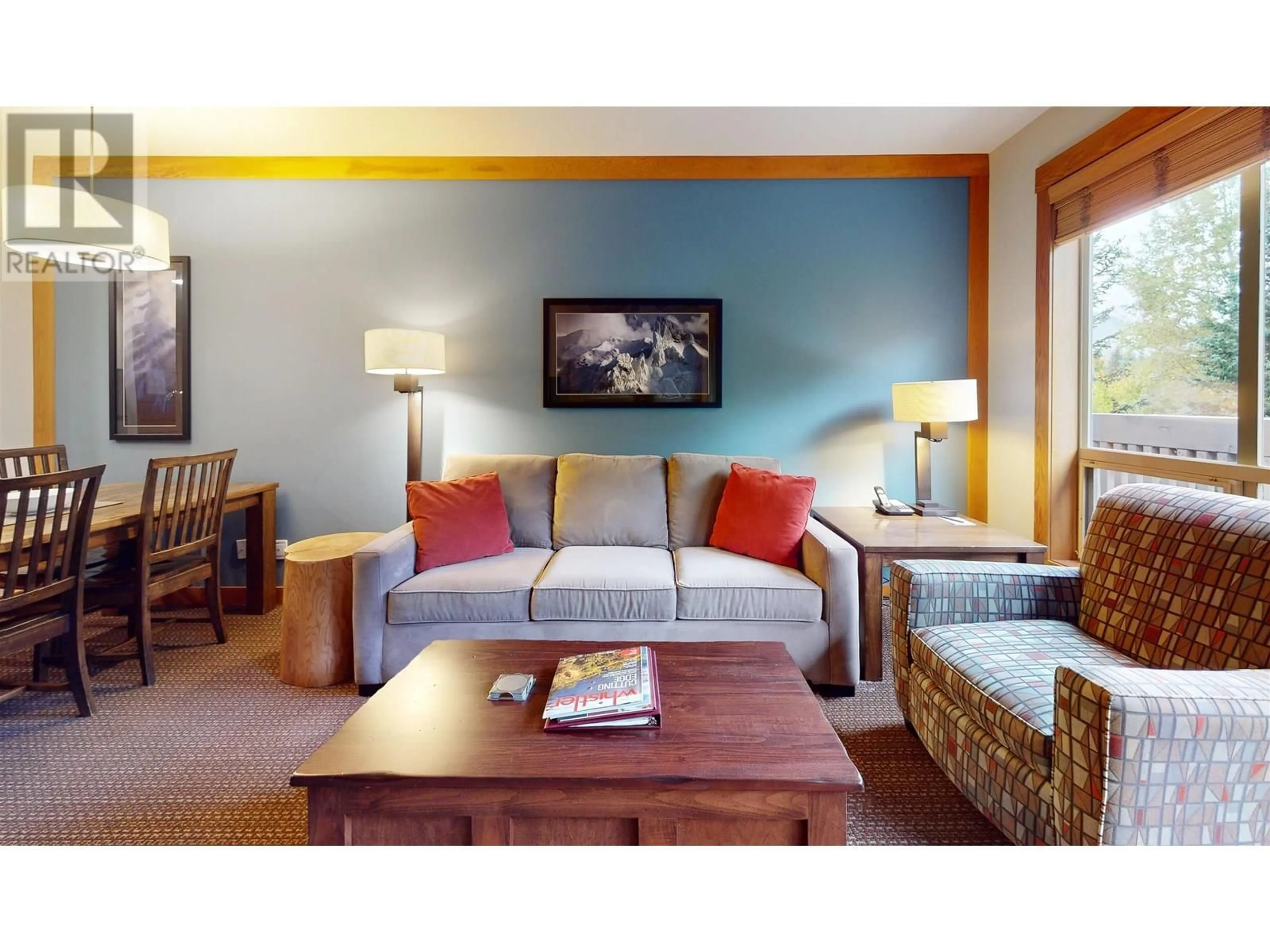 Living room with furniture, wood/laminate floor for 218B - 2036 LONDON LANE, Whistler British Columbia V8E0N7