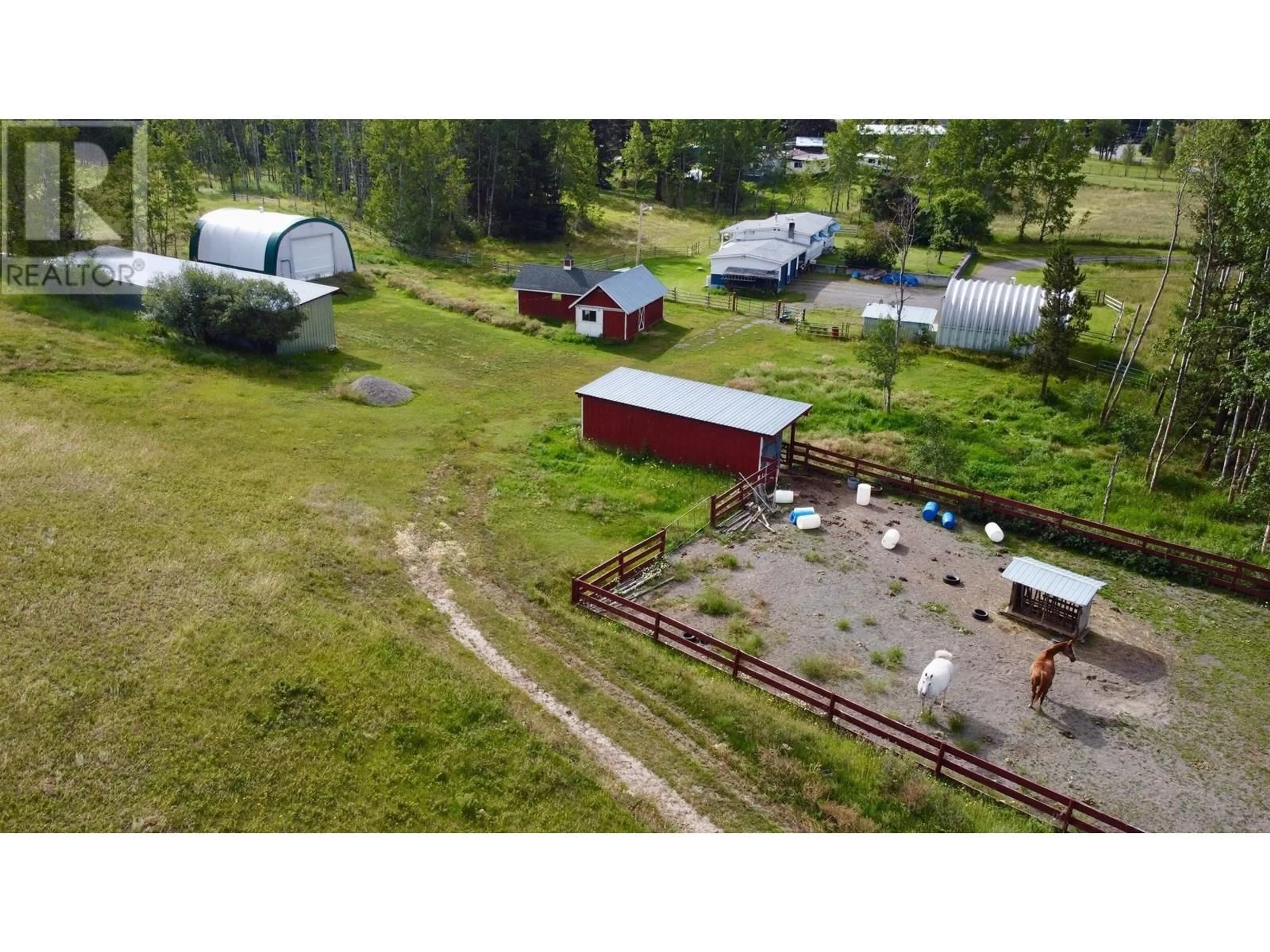 A pic from outside/outdoor area/front of a property/back of a property/a pic from drone, unknown for 5363 DAWSON ROAD, 103 Mile House British Columbia V0K2E1