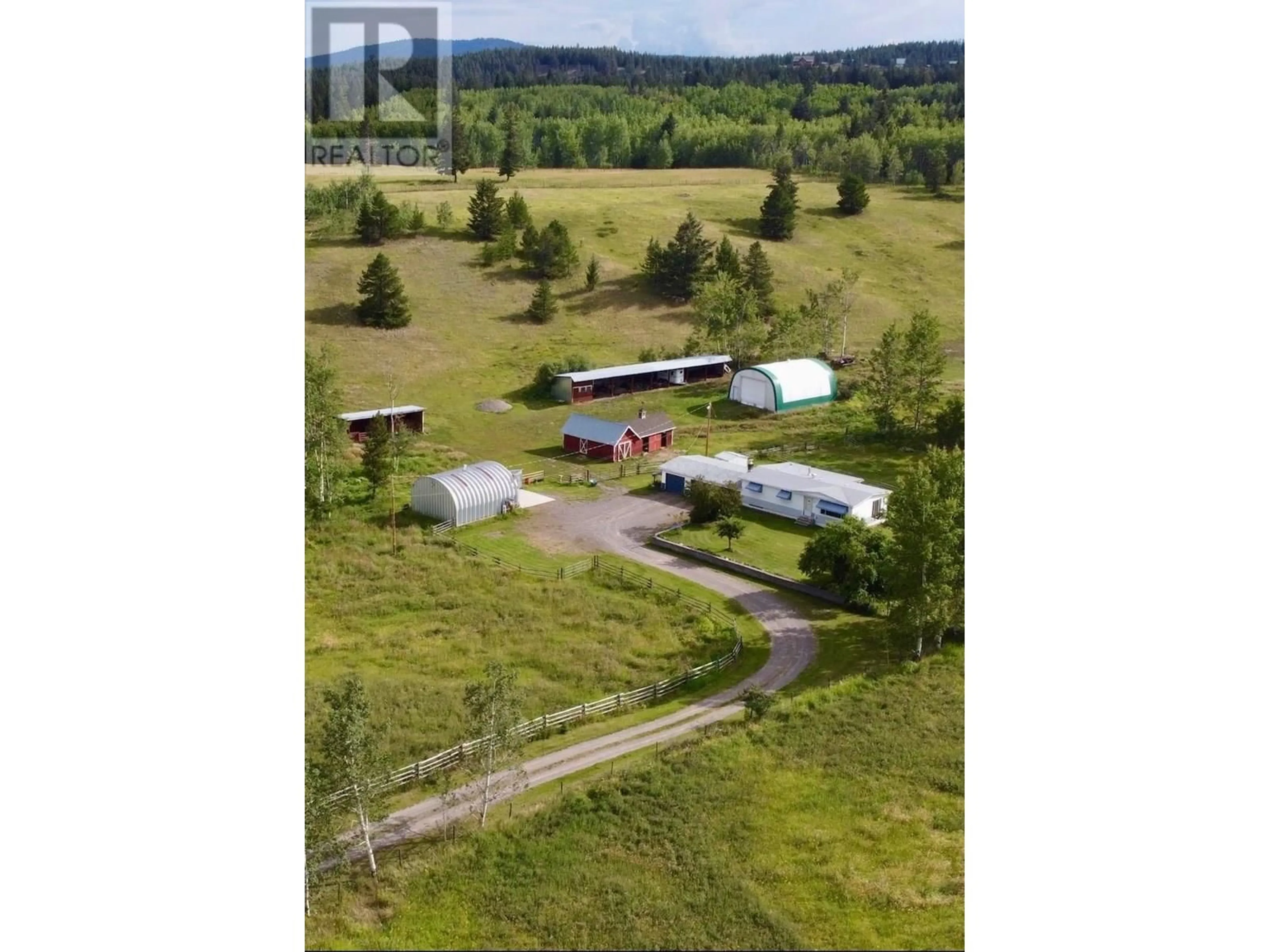 A pic from outside/outdoor area/front of a property/back of a property/a pic from drone, street for 5363 DAWSON ROAD, 103 Mile House British Columbia V0K2E1