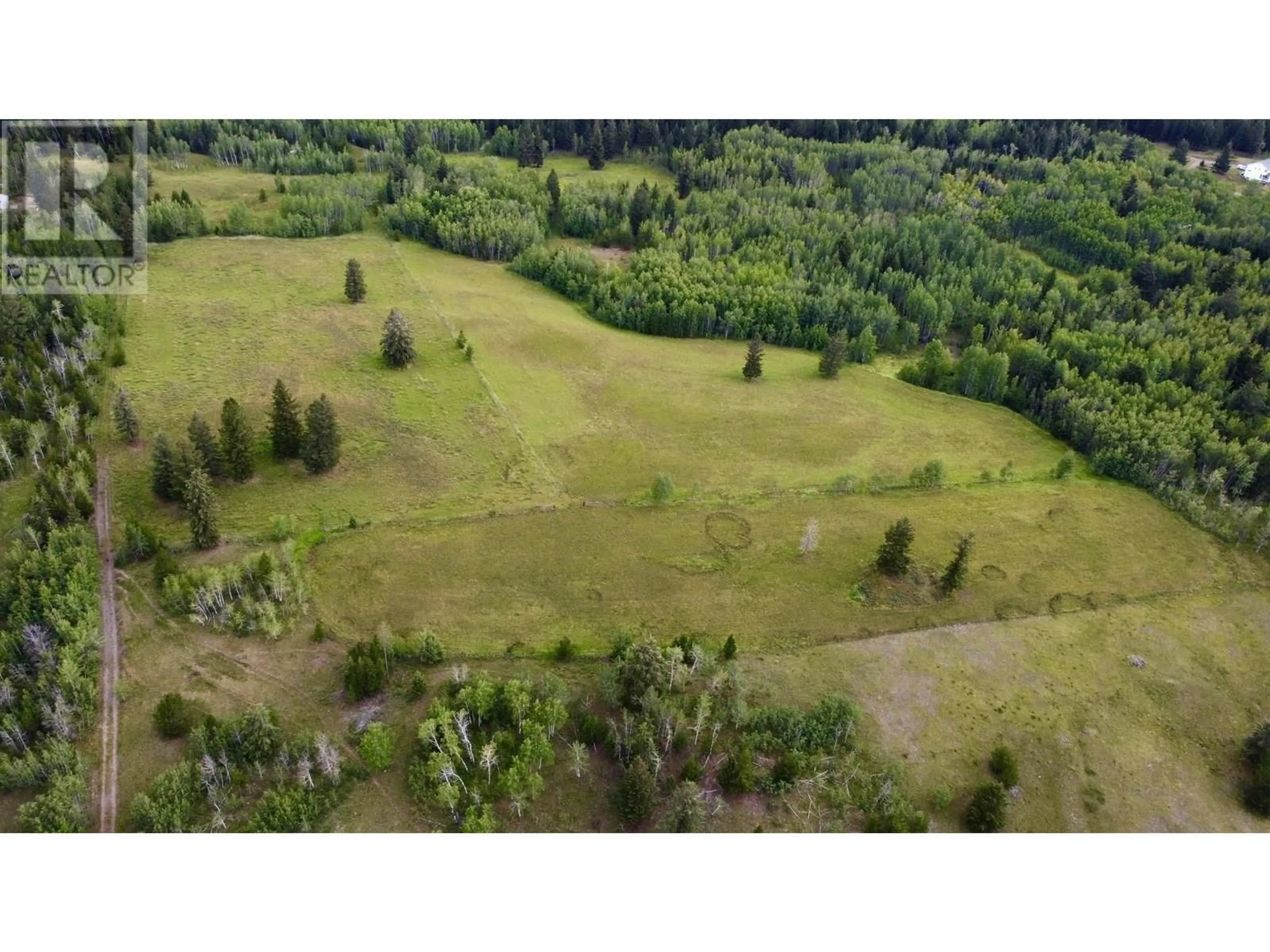 A pic from outside/outdoor area/front of a property/back of a property/a pic from drone, forest/trees view for 5363 DAWSON ROAD, 103 Mile House British Columbia V0K2E1