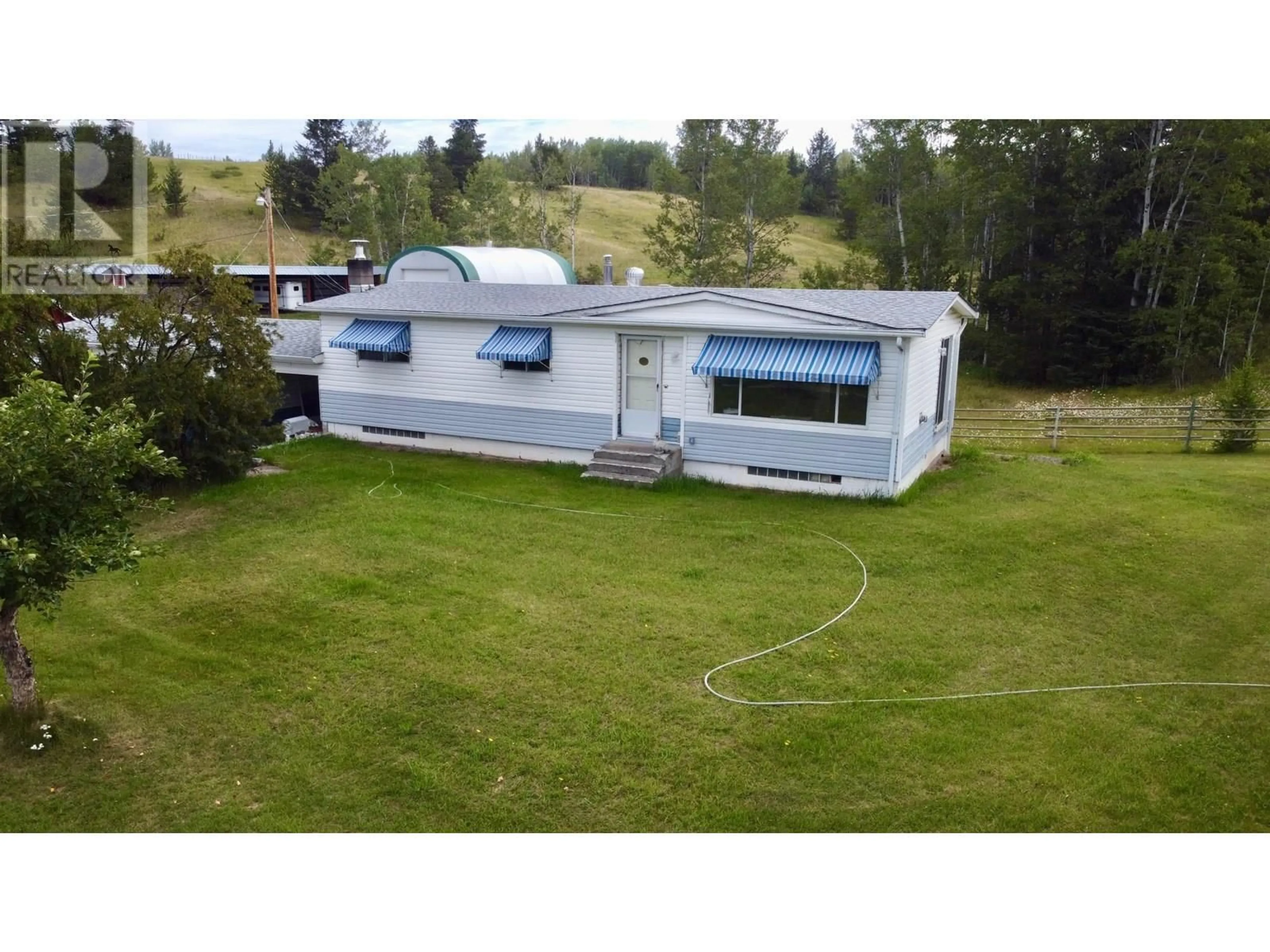 A pic from outside/outdoor area/front of a property/back of a property/a pic from drone, mountain view for 5363 DAWSON ROAD, 103 Mile House British Columbia V0K2E1