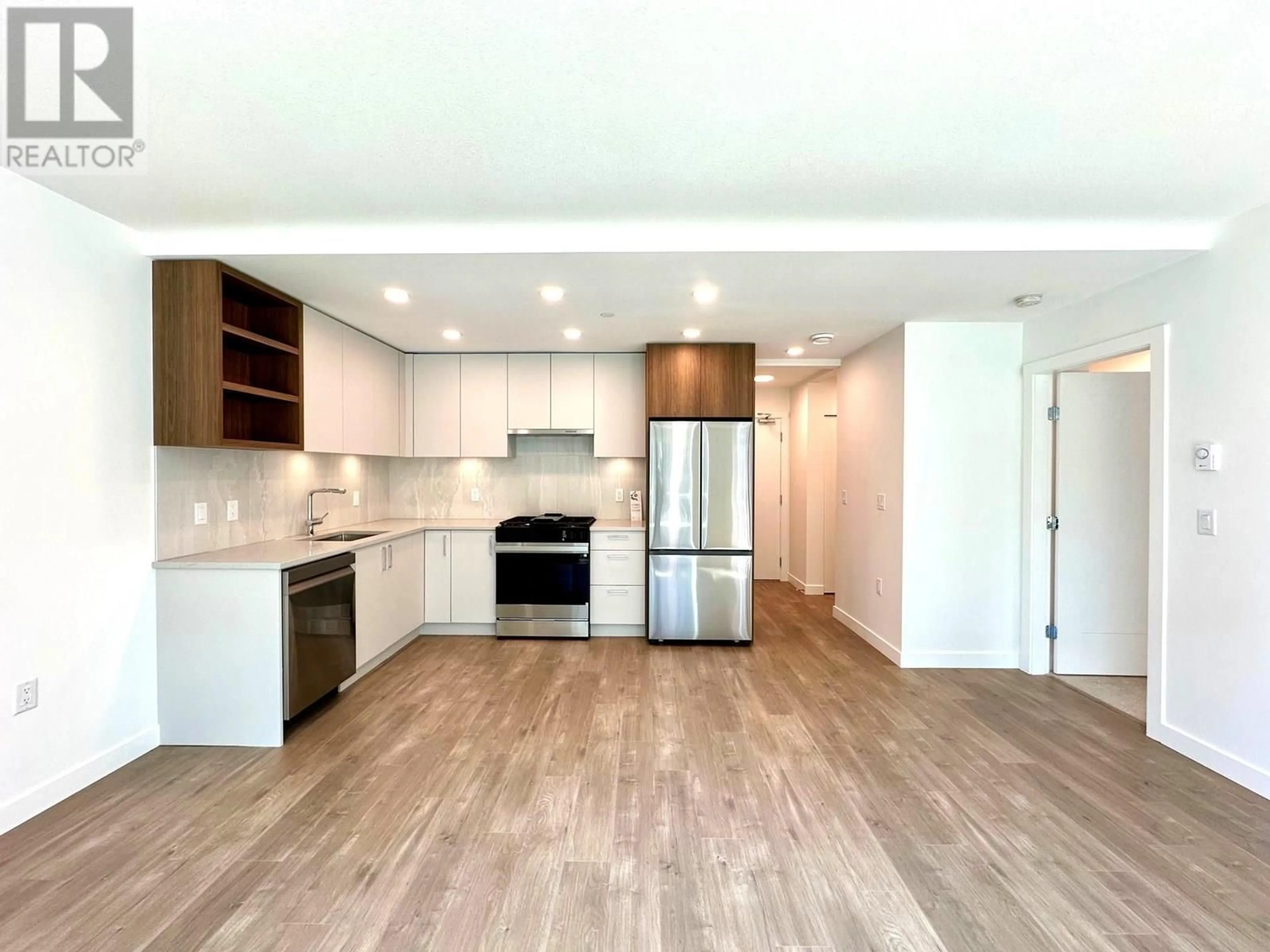 Open concept kitchen, wood/laminate floor for 313 - 723 GROVER AVENUE, Coquitlam British Columbia V3J0L9