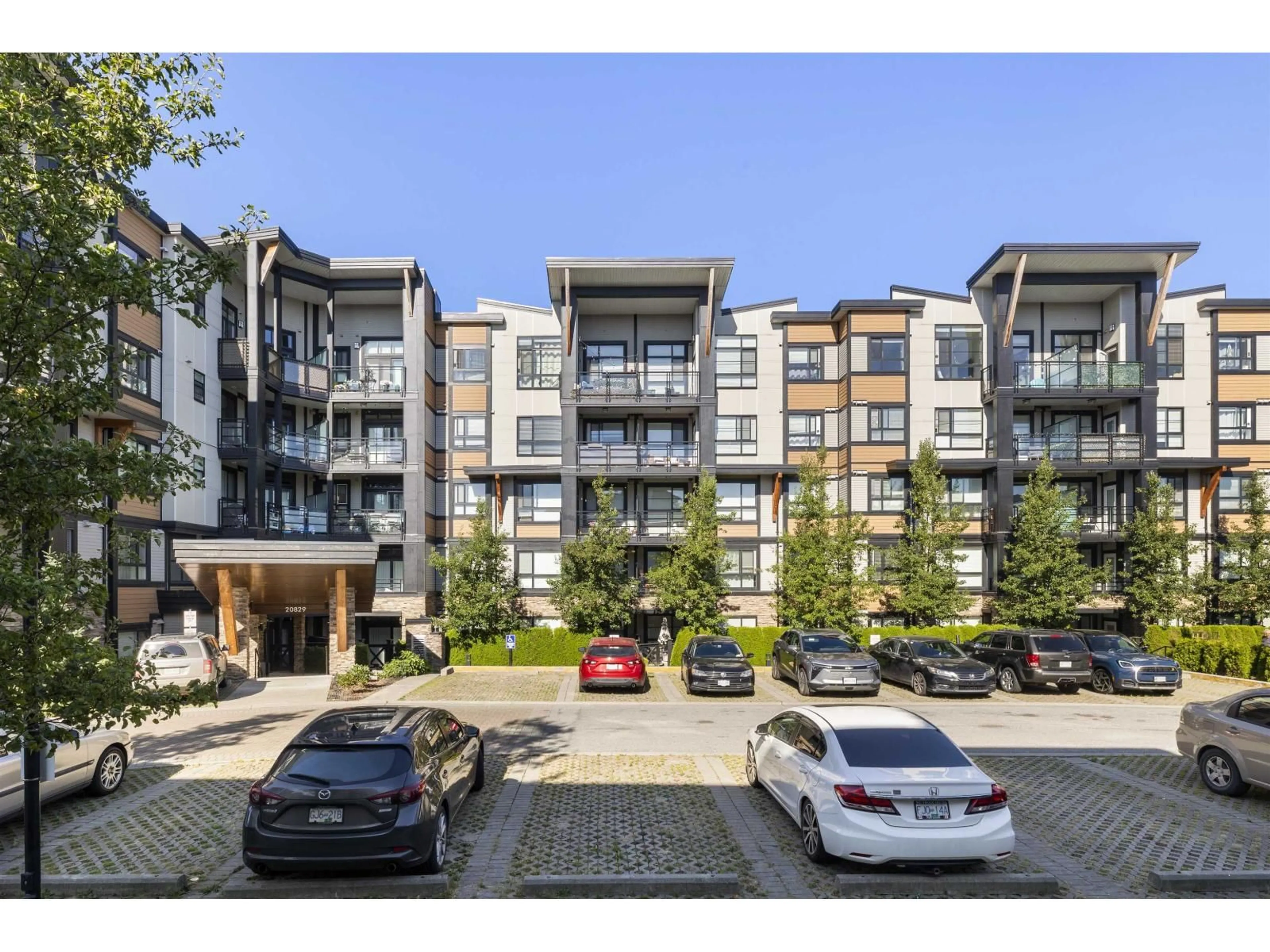 A pic from outside/outdoor area/front of a property/back of a property/a pic from drone, street for 210 - 20829 77A, Langley British Columbia V2Y0W7