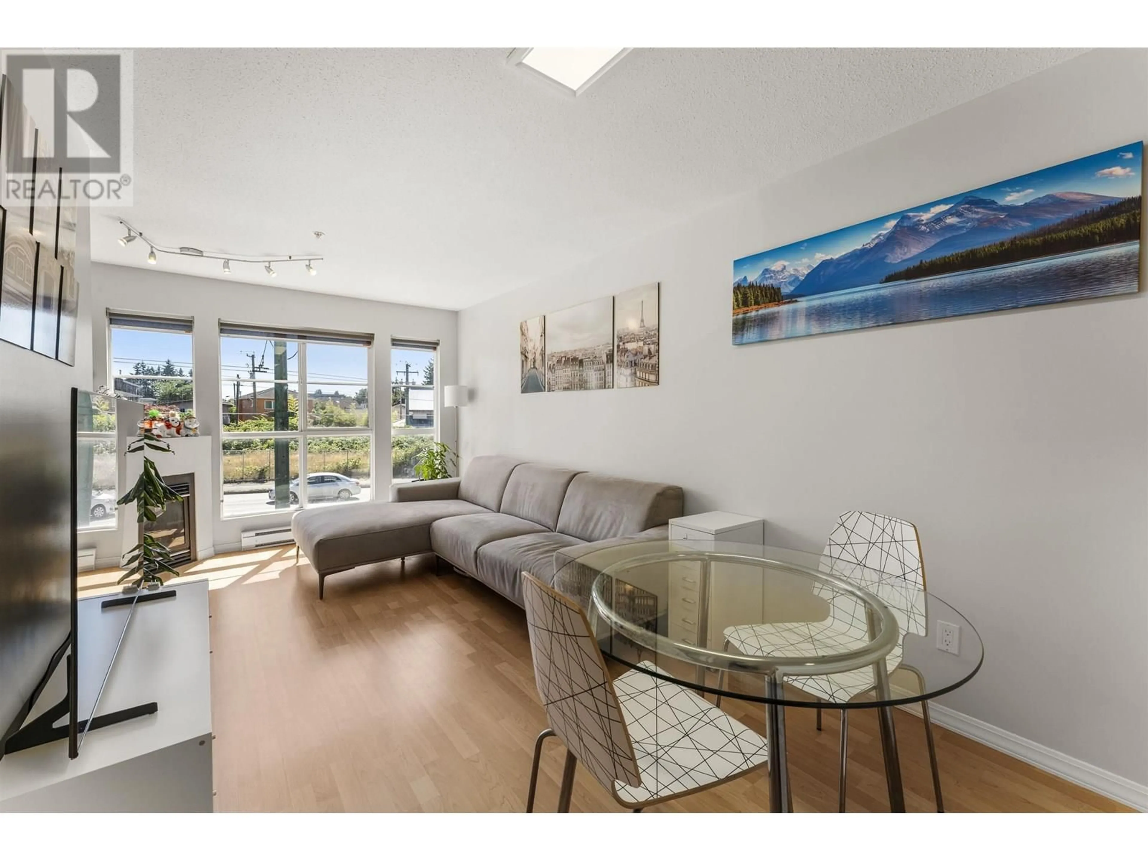 Living room with furniture, wood/laminate floor for 210 - 2973 KINGSWAY, Vancouver British Columbia V5R5J4