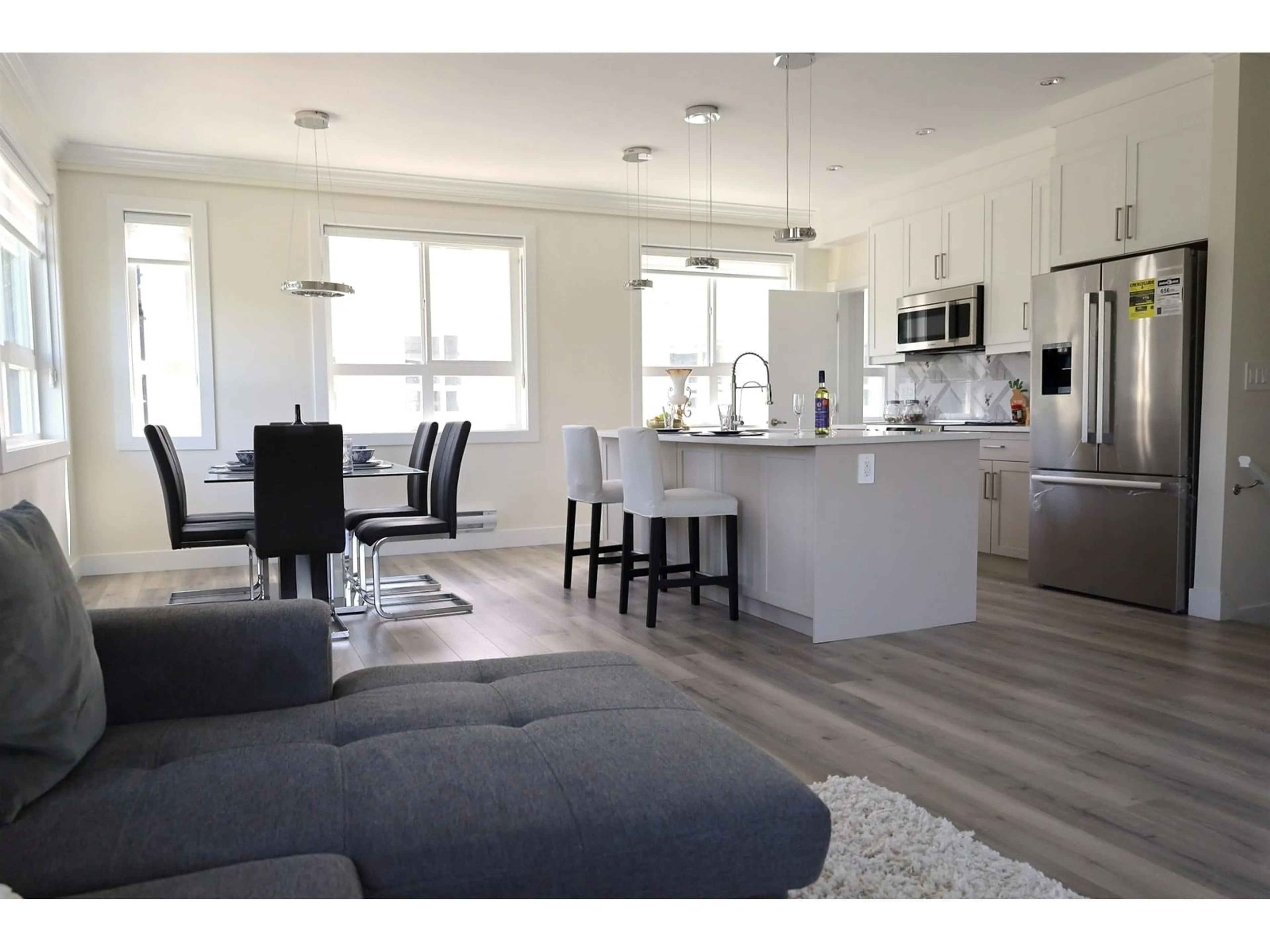 Open concept kitchen, wood/laminate floor for 15 - 8181 135A, Surrey British Columbia V3W3N8