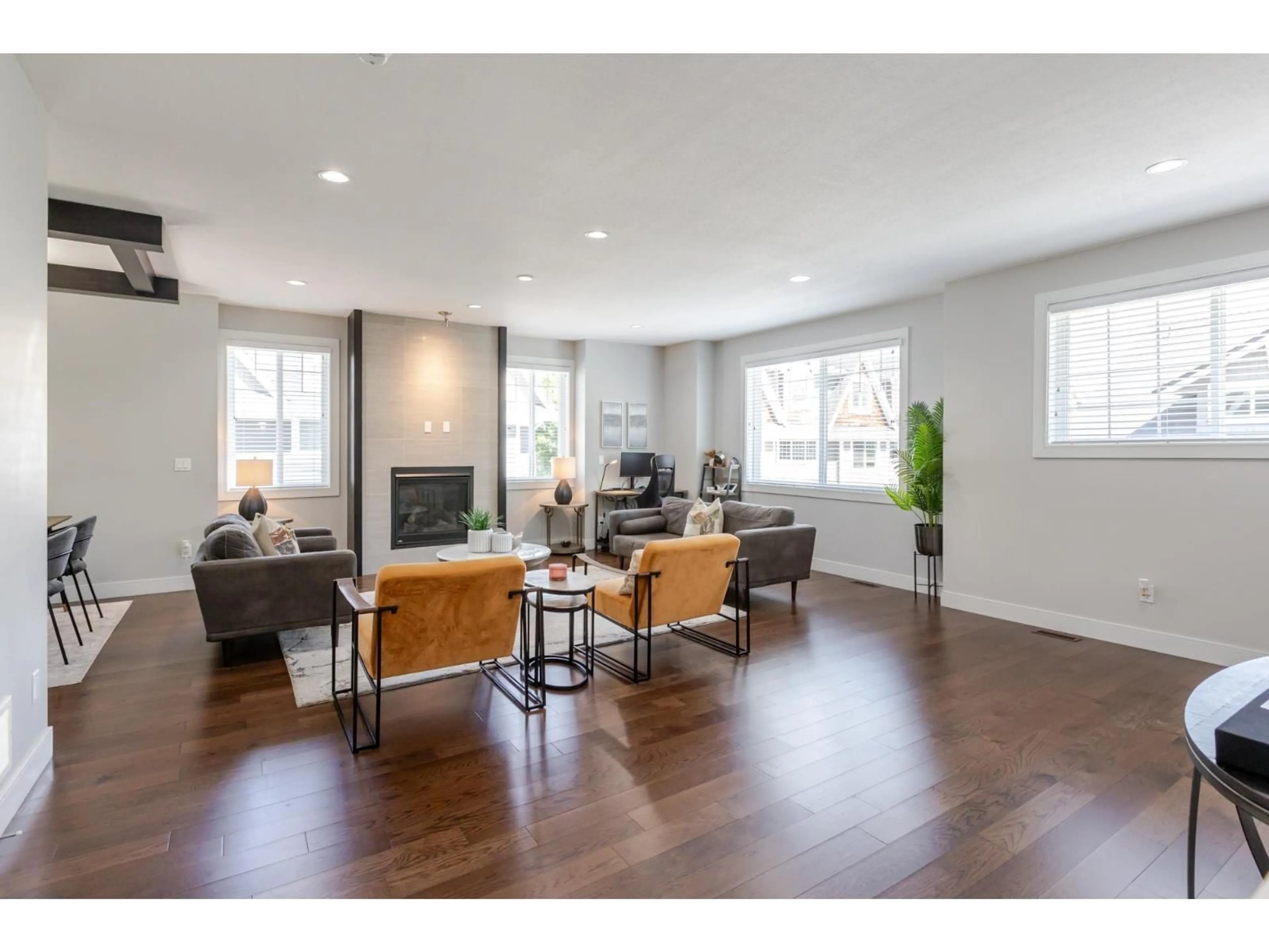Living room with furniture, wood/laminate floor for 63 - 15988 32, Surrey British Columbia V3Z2J4