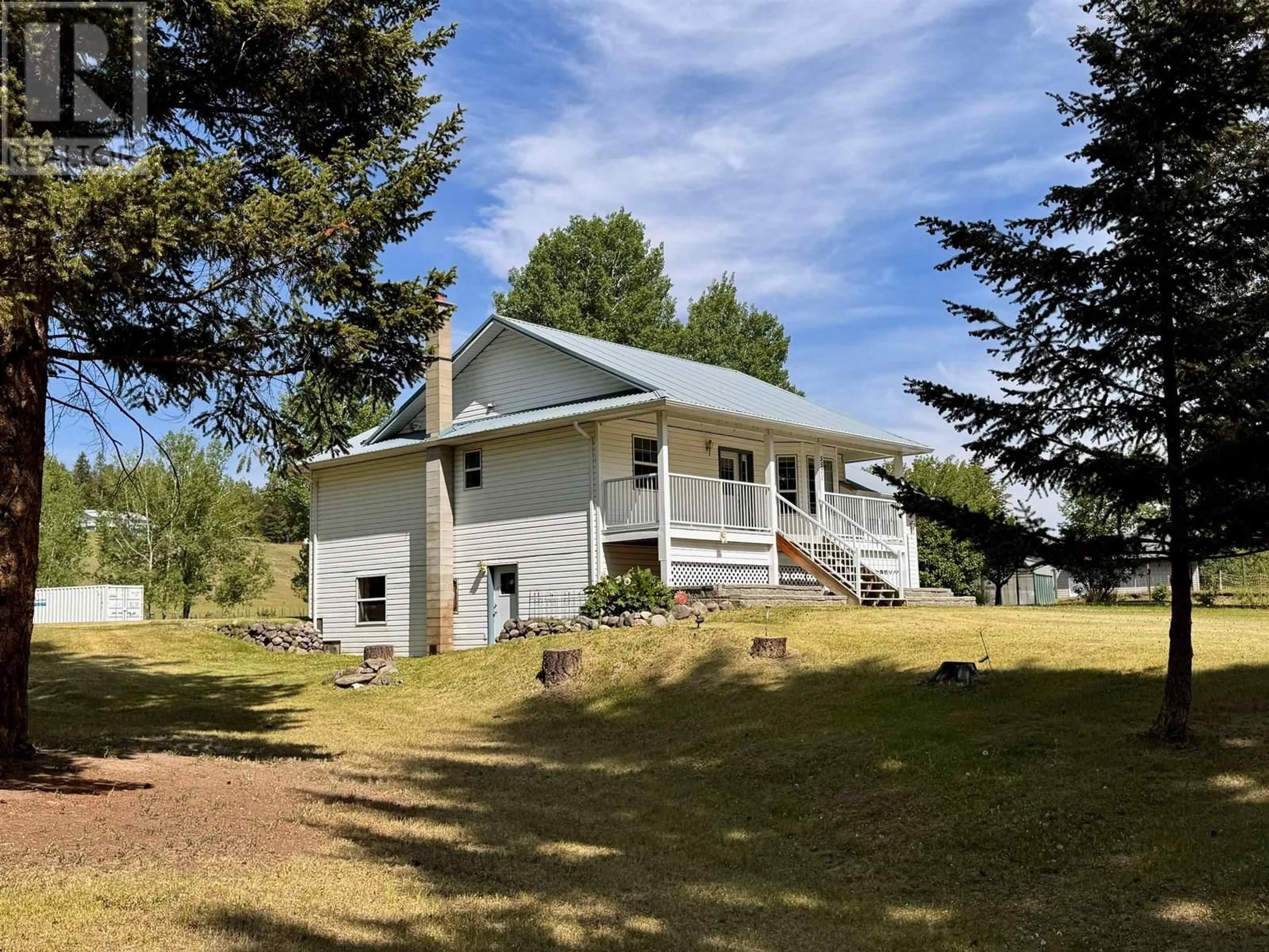A pic from outside/outdoor area/front of a property/back of a property/a pic from drone, unknown for 5571 LAKESIDE COURT, 103 Mile House British Columbia V0K2E1