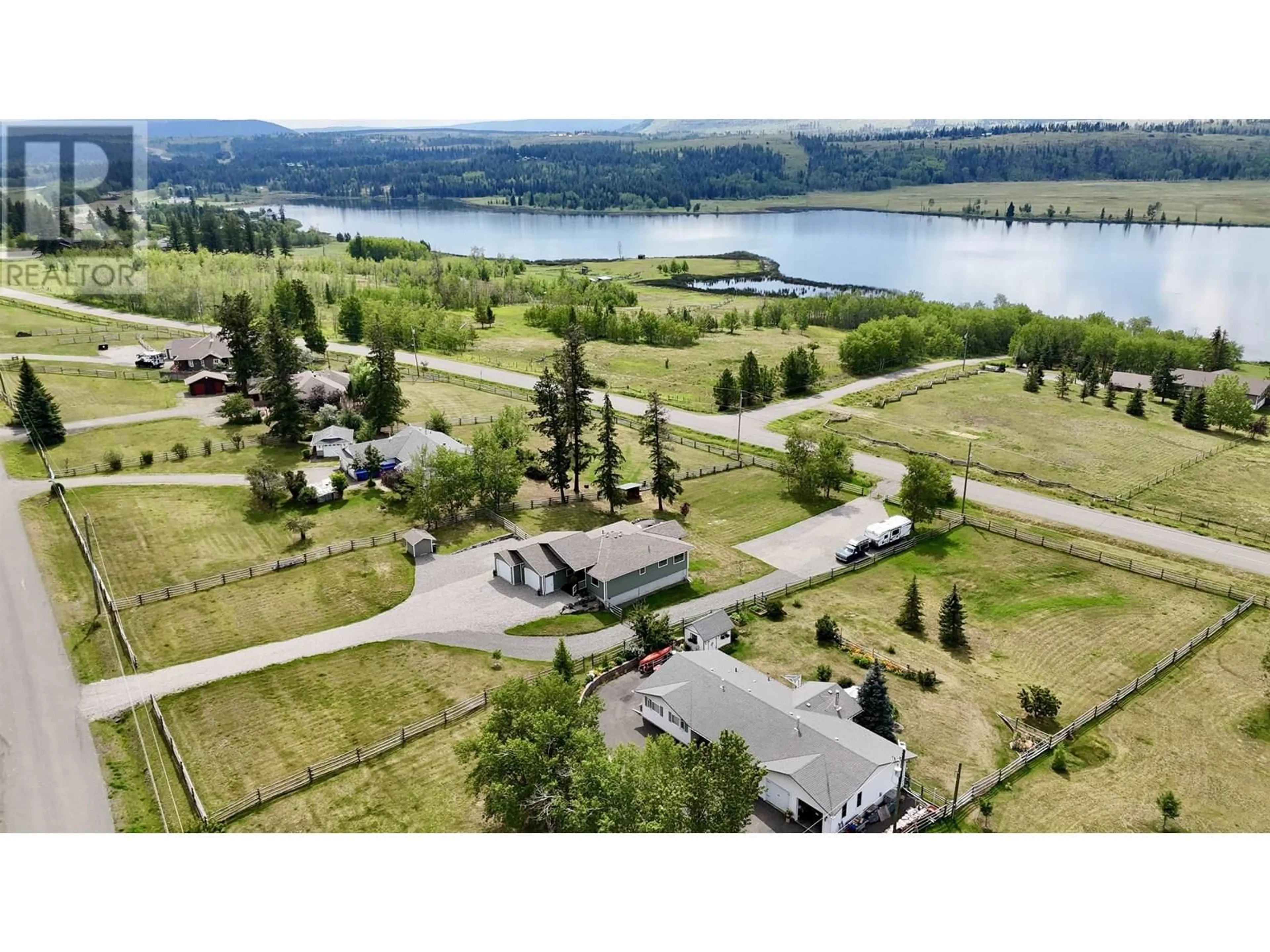 A pic from outside/outdoor area/front of a property/back of a property/a pic from drone, water/lake/river/ocean view for 5164 LAKES ROAD, 100 Mile House British Columbia V0K2E1