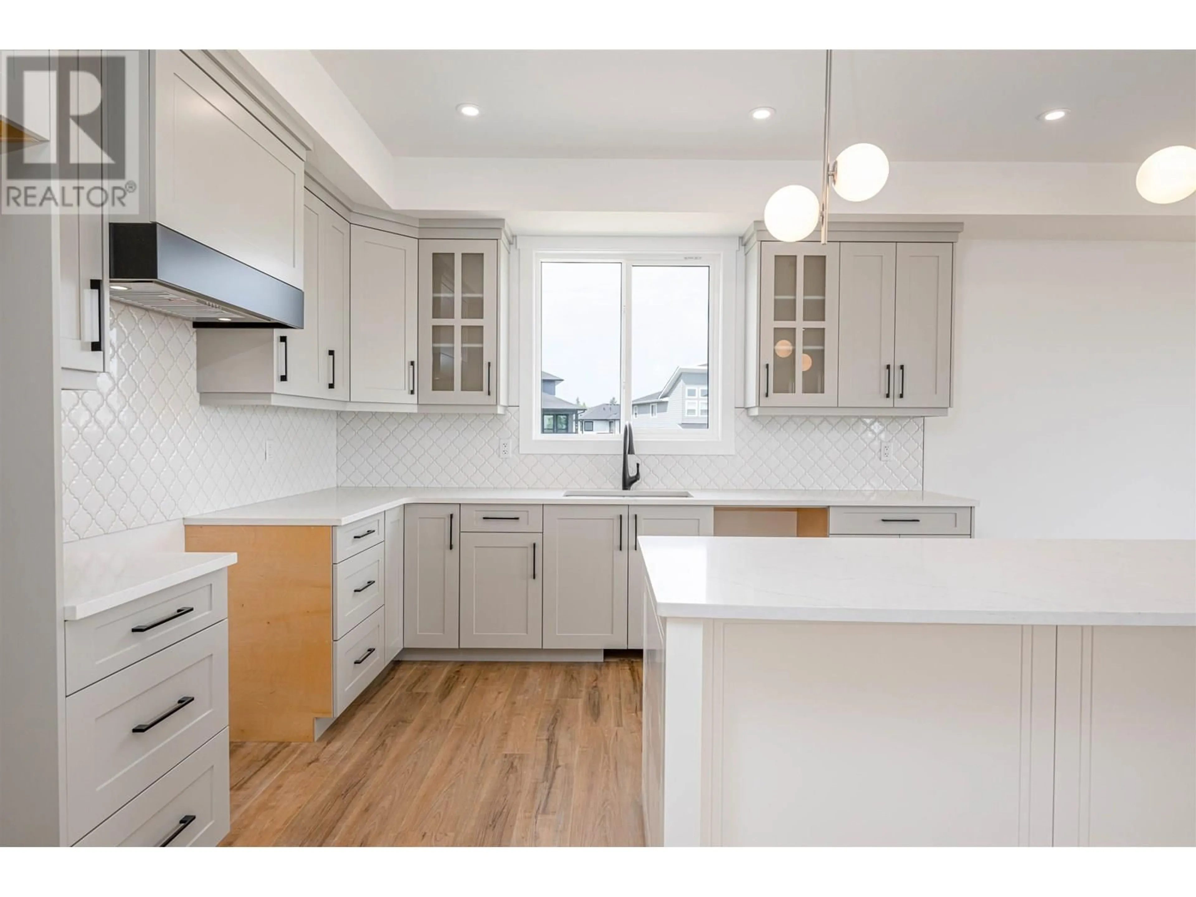 Open concept kitchen, wood/laminate floor for 1125 MONTEITH COURT, Prince George British Columbia V2N0G8