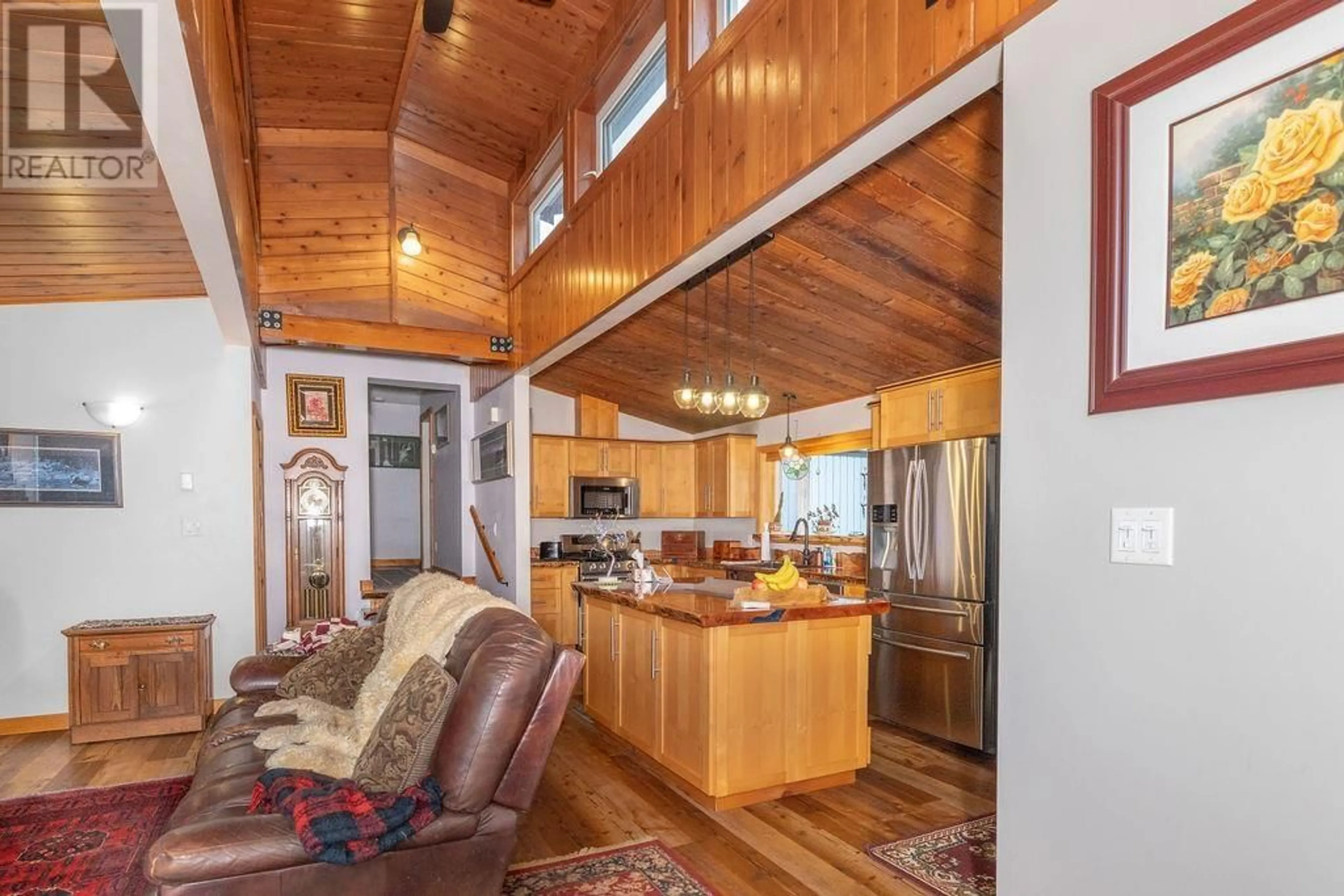 Open concept kitchen, wood/laminate floor for 8099 NORTHWOOD ROAD, Halfmoon Bay British Columbia V7Z1A8