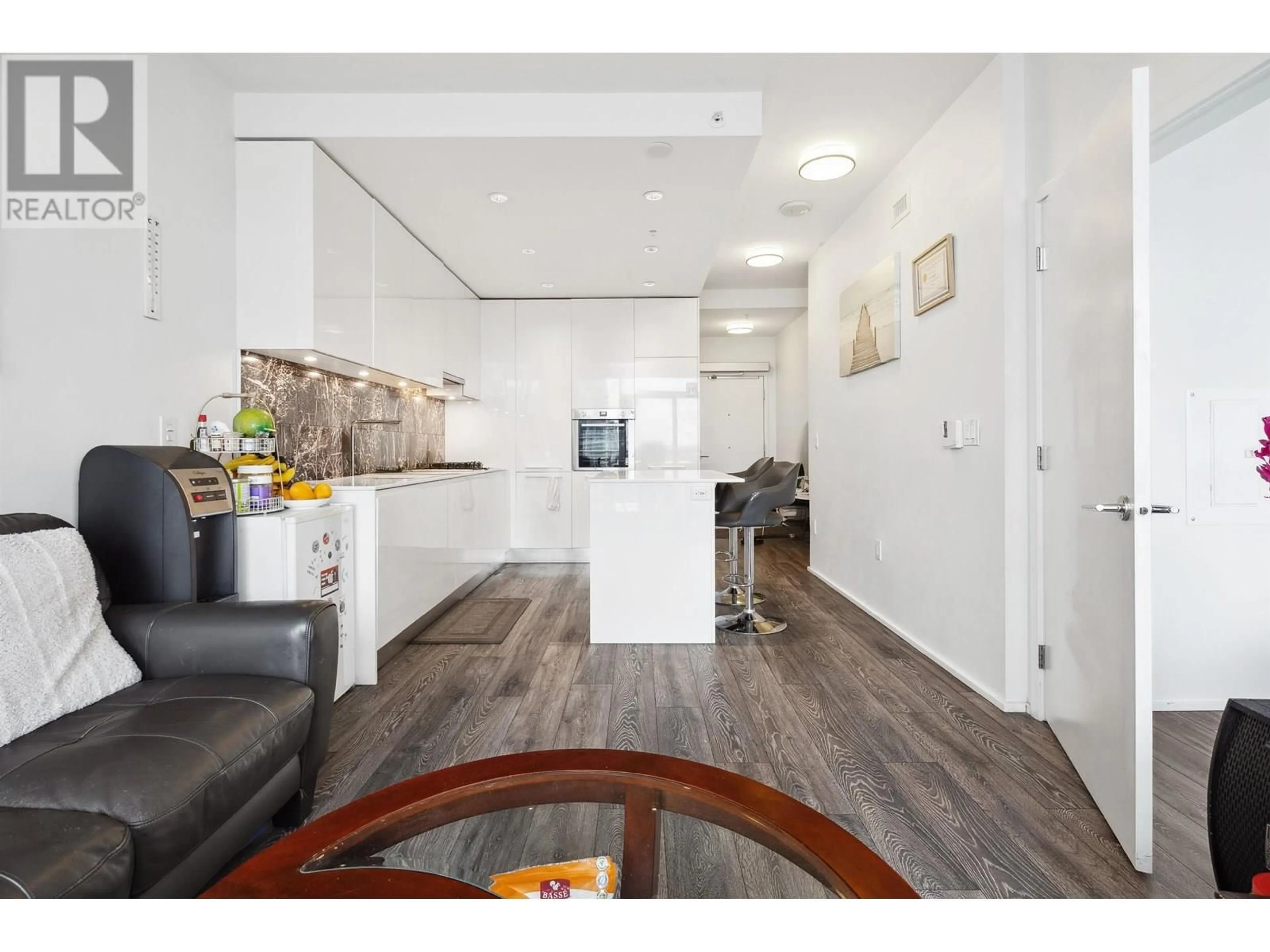 Open concept kitchen, wood/laminate floor for 1508 - 1955 ALPHA WAY, Burnaby British Columbia V5C0K6