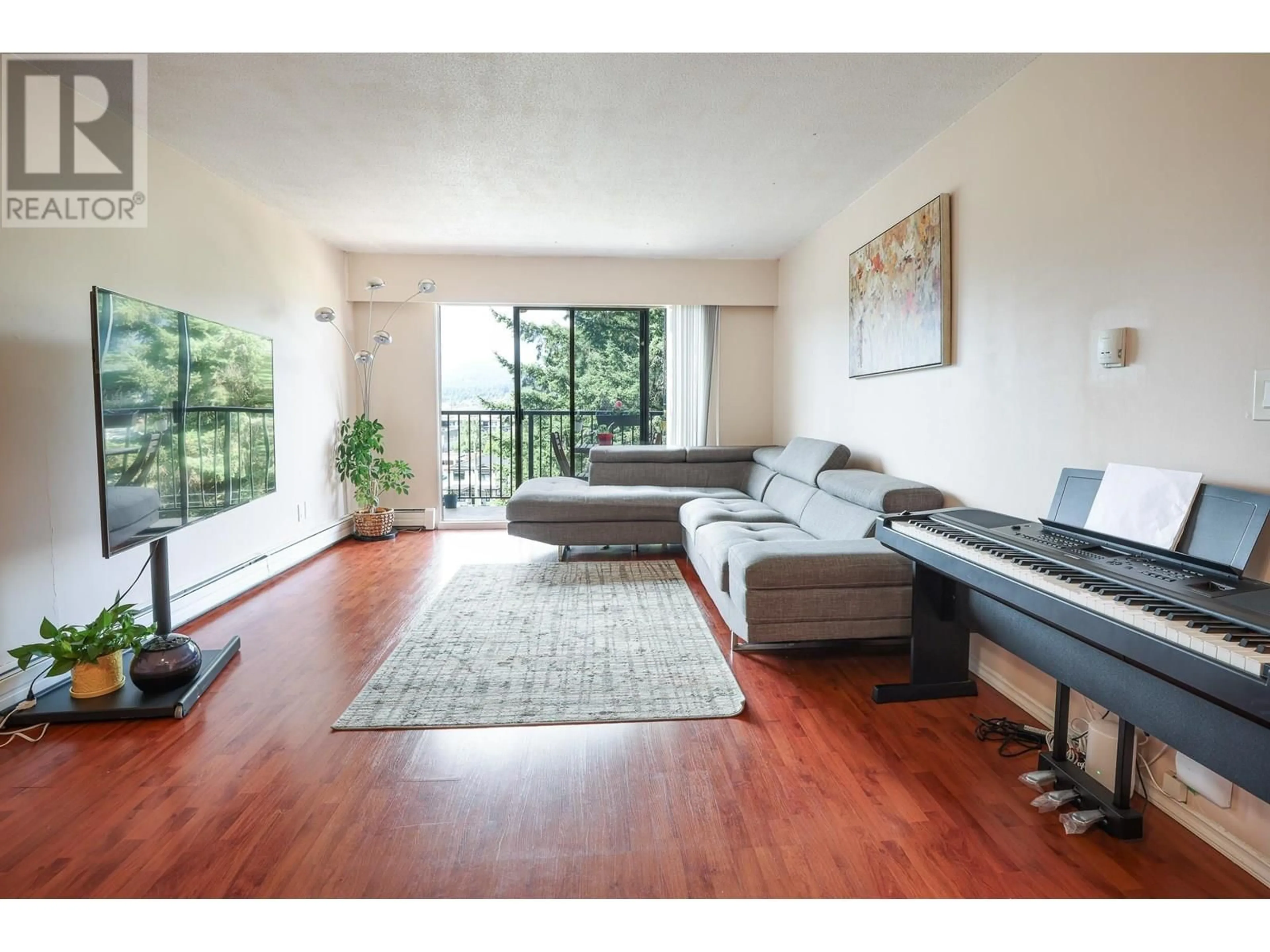 Living room with furniture, wood/laminate floor for 308 - 195 MARY STREET, Port Moody British Columbia V3H2P1
