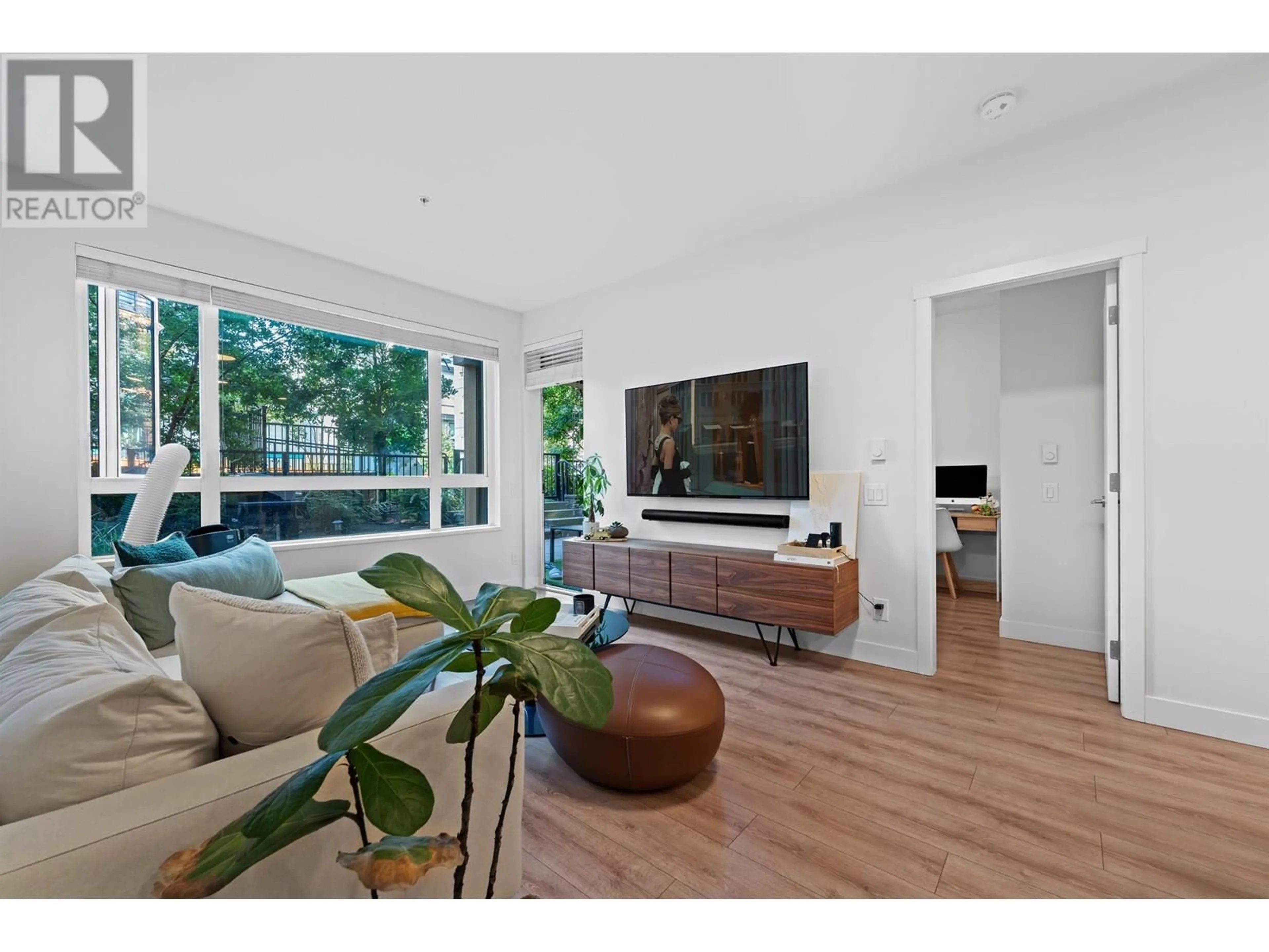 Living room with furniture, wood/laminate floor for 102 - 721 ANSKAR COURT, Coquitlam British Columbia V3J0L4